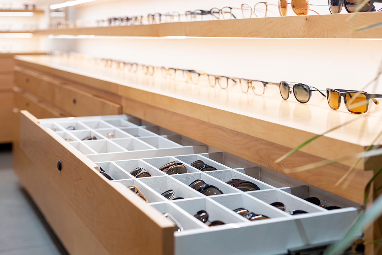 Glasses display and storage at a luxury optical store.