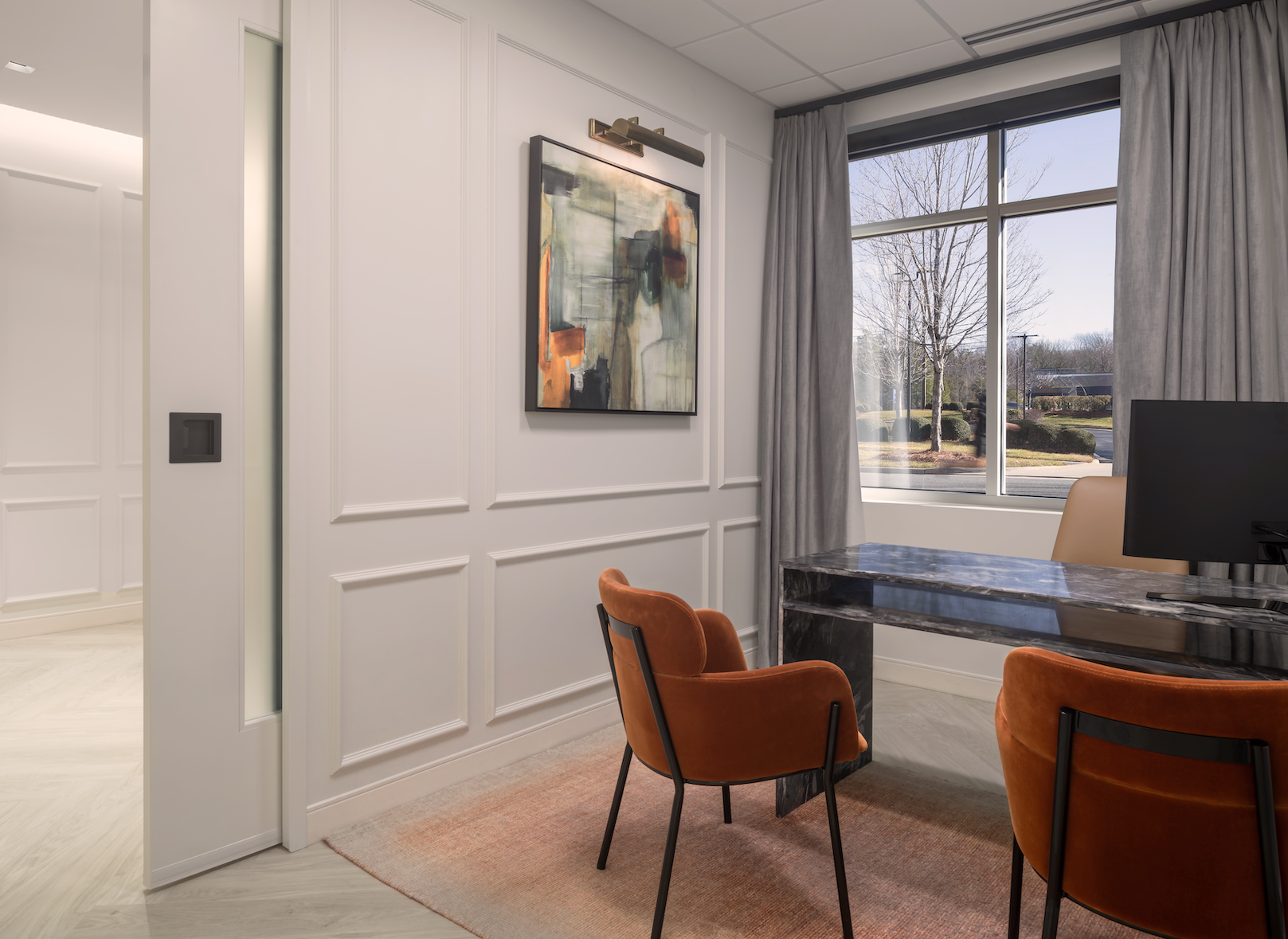 An elegant patient coordinator's office at a doctor's office.