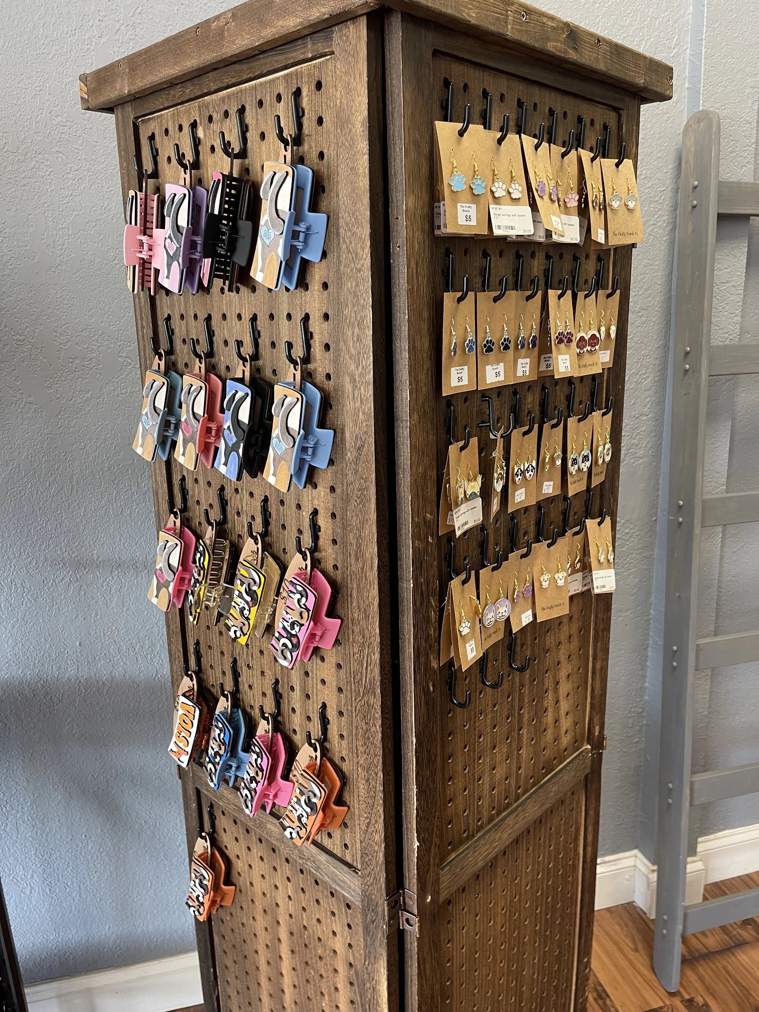 A display showing hair clips and earings made by The Krafty Bunch