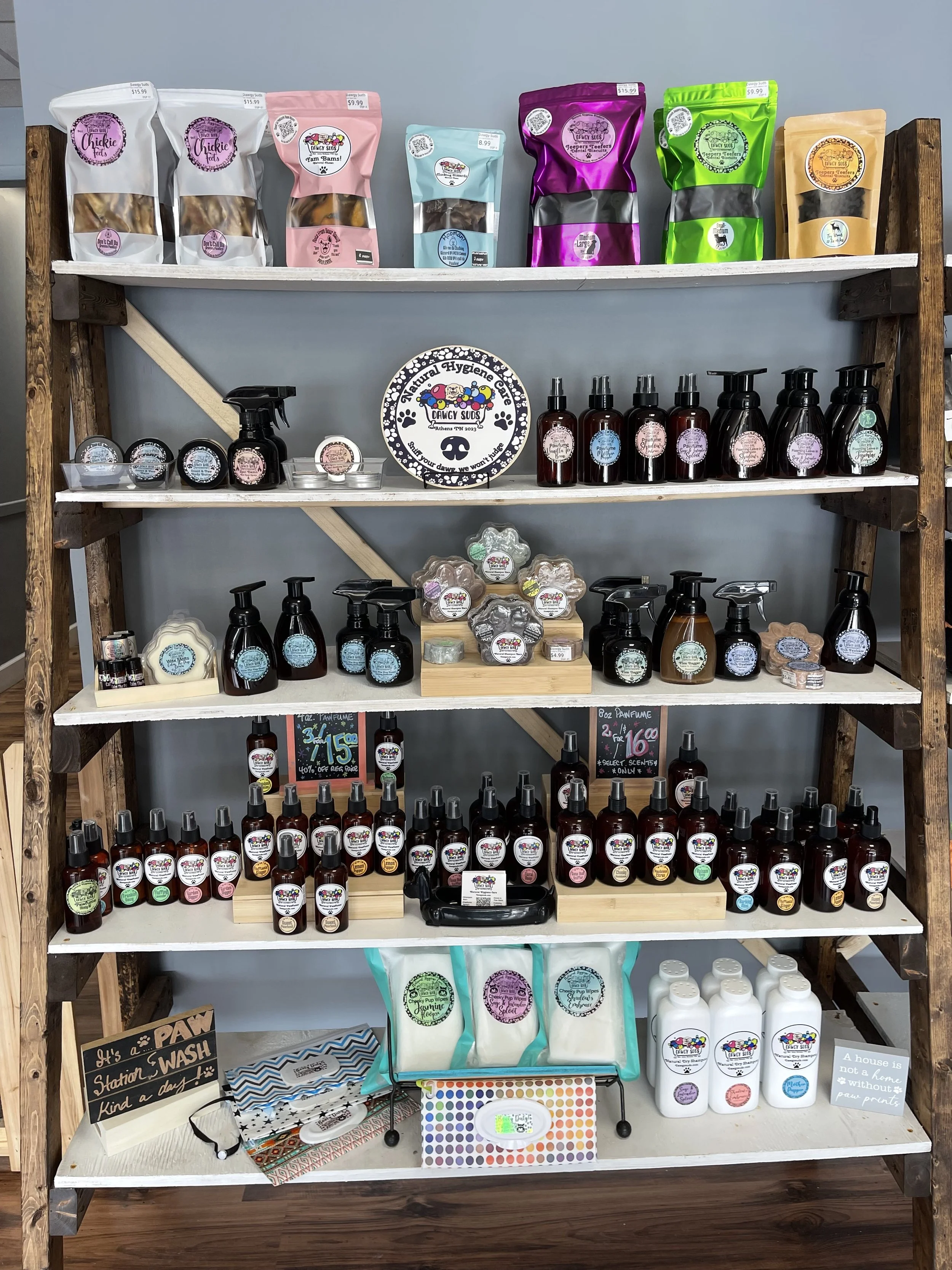 Image of a shelf full of products made by Doggy Sudz