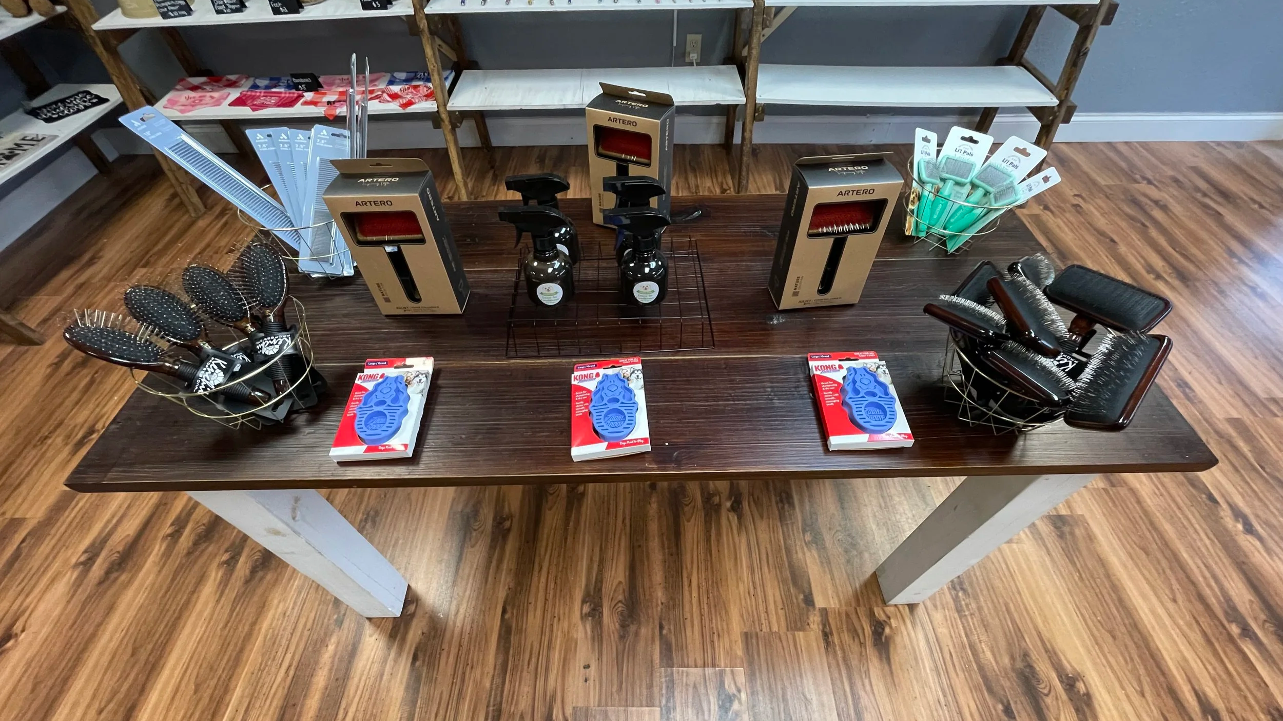 An image of a table with dog grooming tools on it