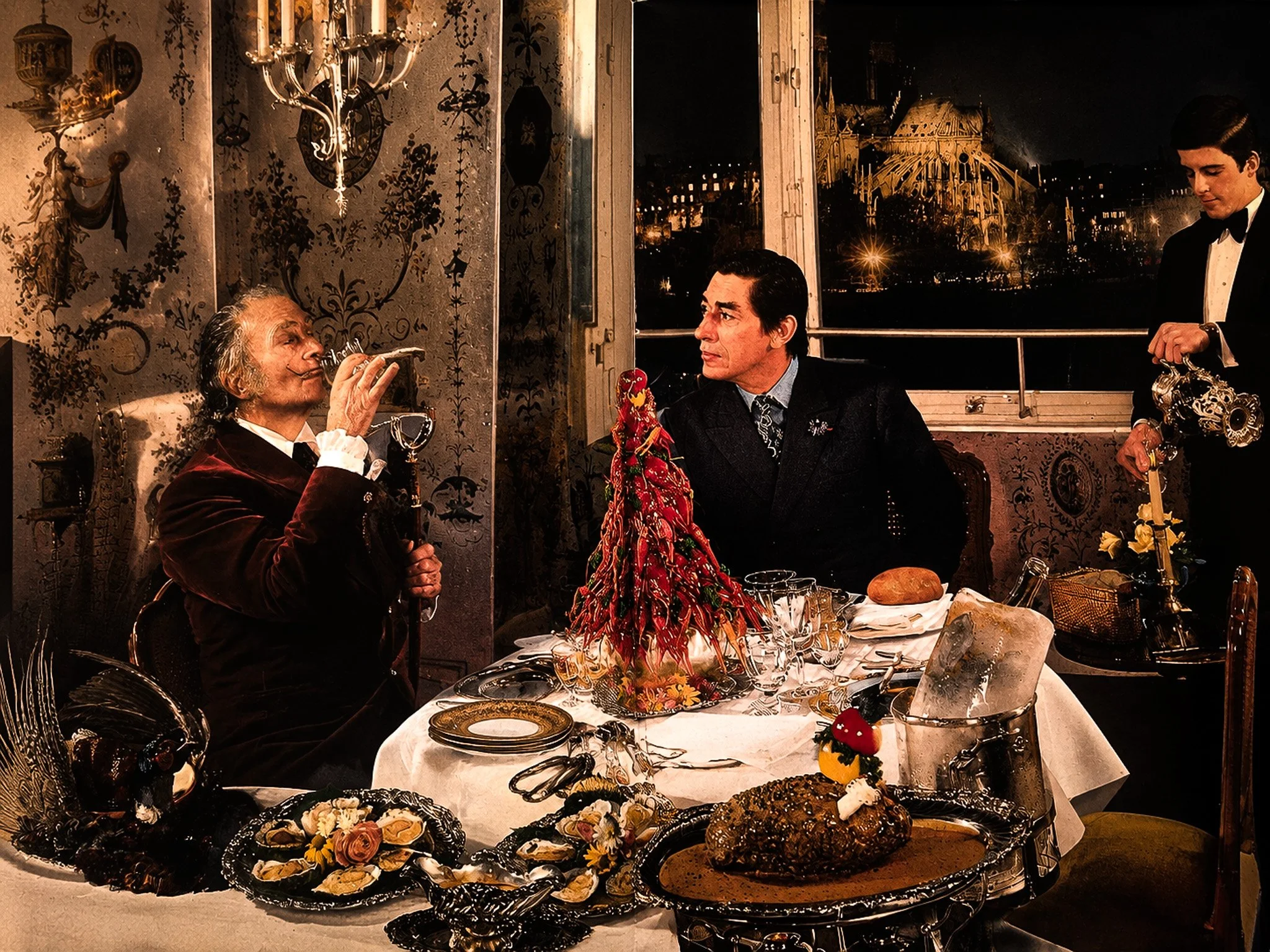 Photograph of Salvador Dali at an elaborate dining table