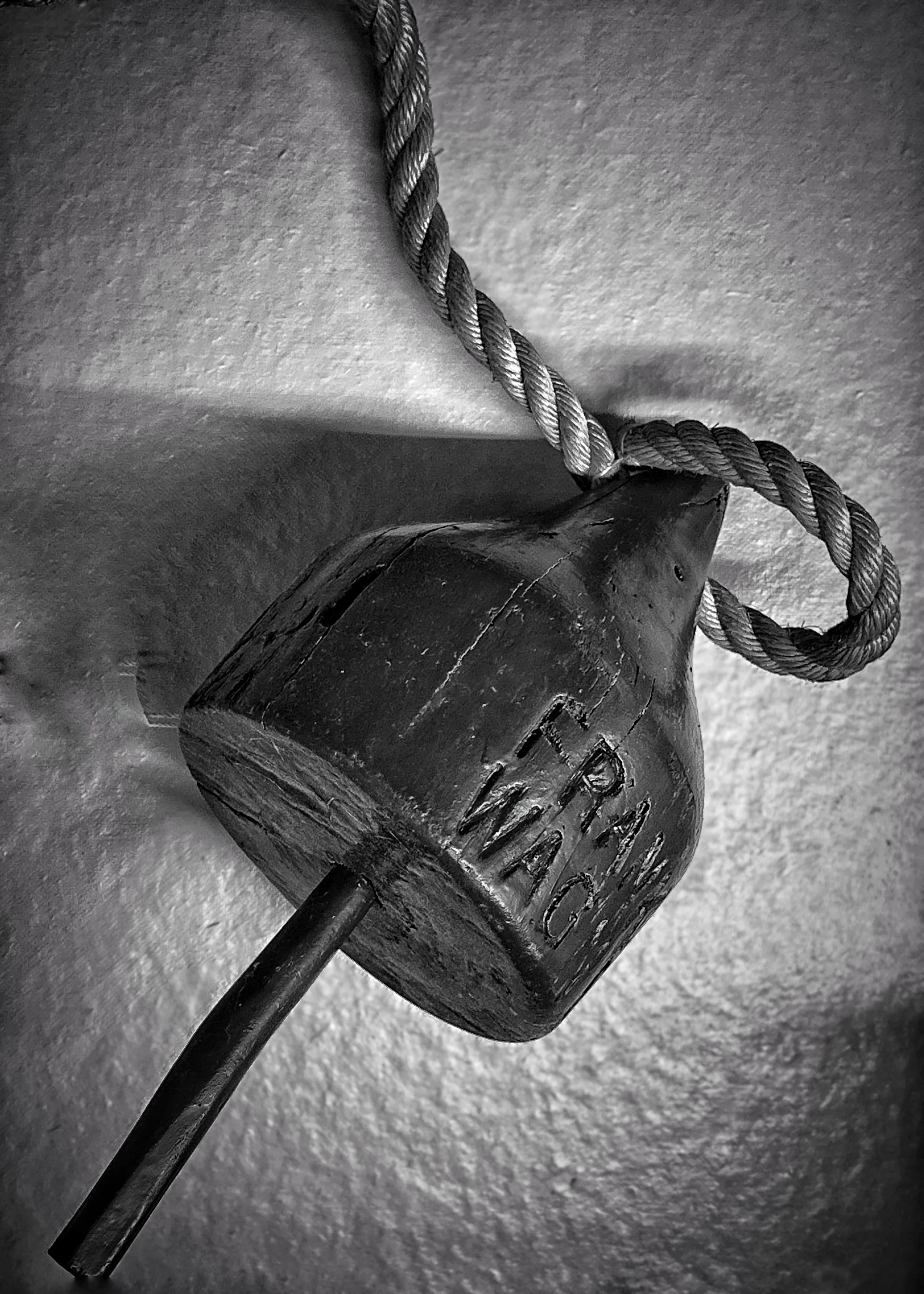 A black and white photo of a small buoy
