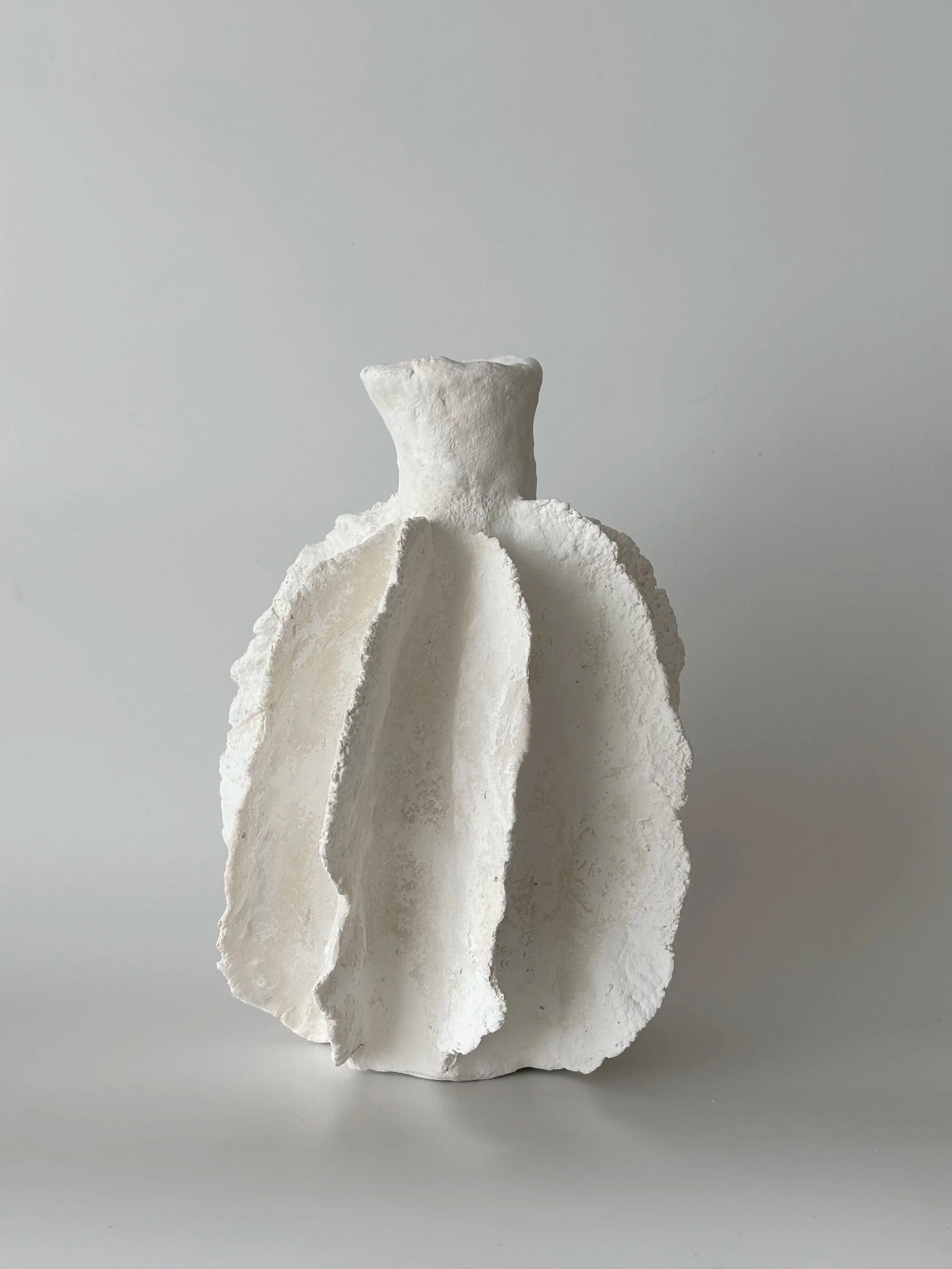 Wavy Vase N.45, handmade paper clay vase, side view. Papier Atelier London