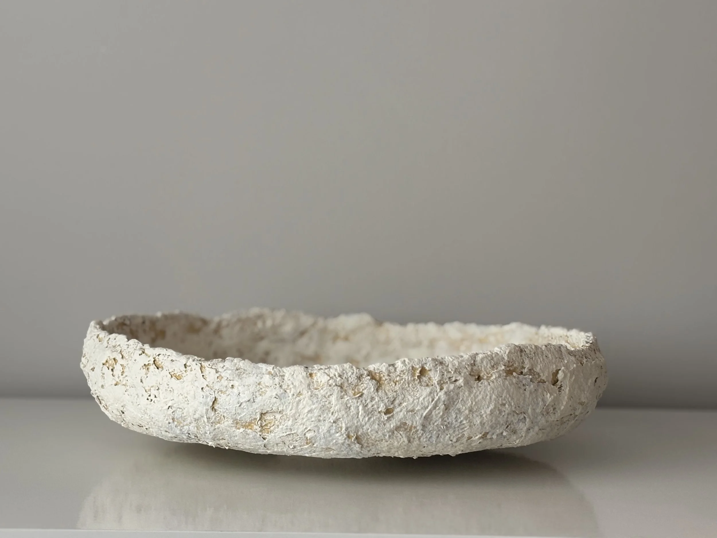 Side profile of Layered Tray N.19 in Wabi-Sabi inspired paper clay, showing the sculptural silhouette and textured surface, London atelier