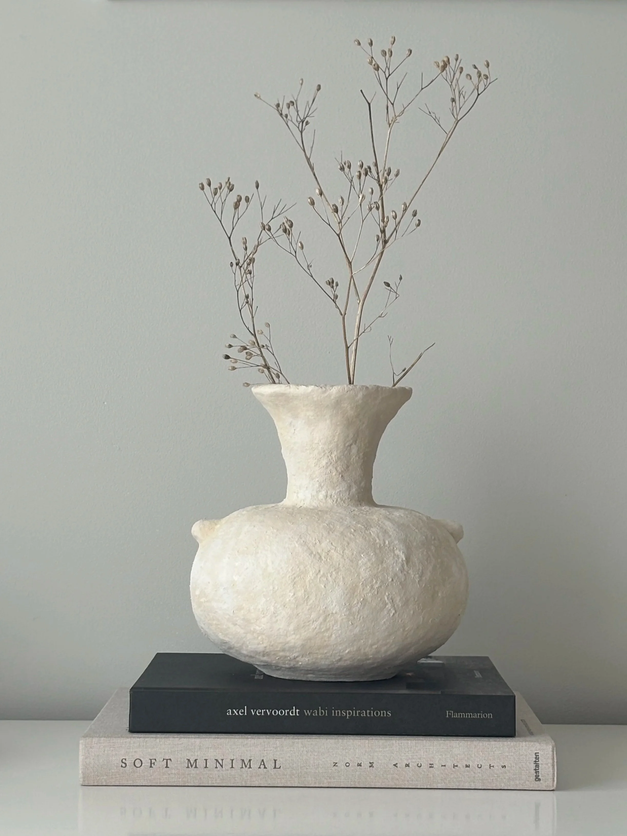 Ecru Vase N.71, ecru paper clay vase viewed from an alternate angle highlighting asymmetrical shape, from Papier Atelier London