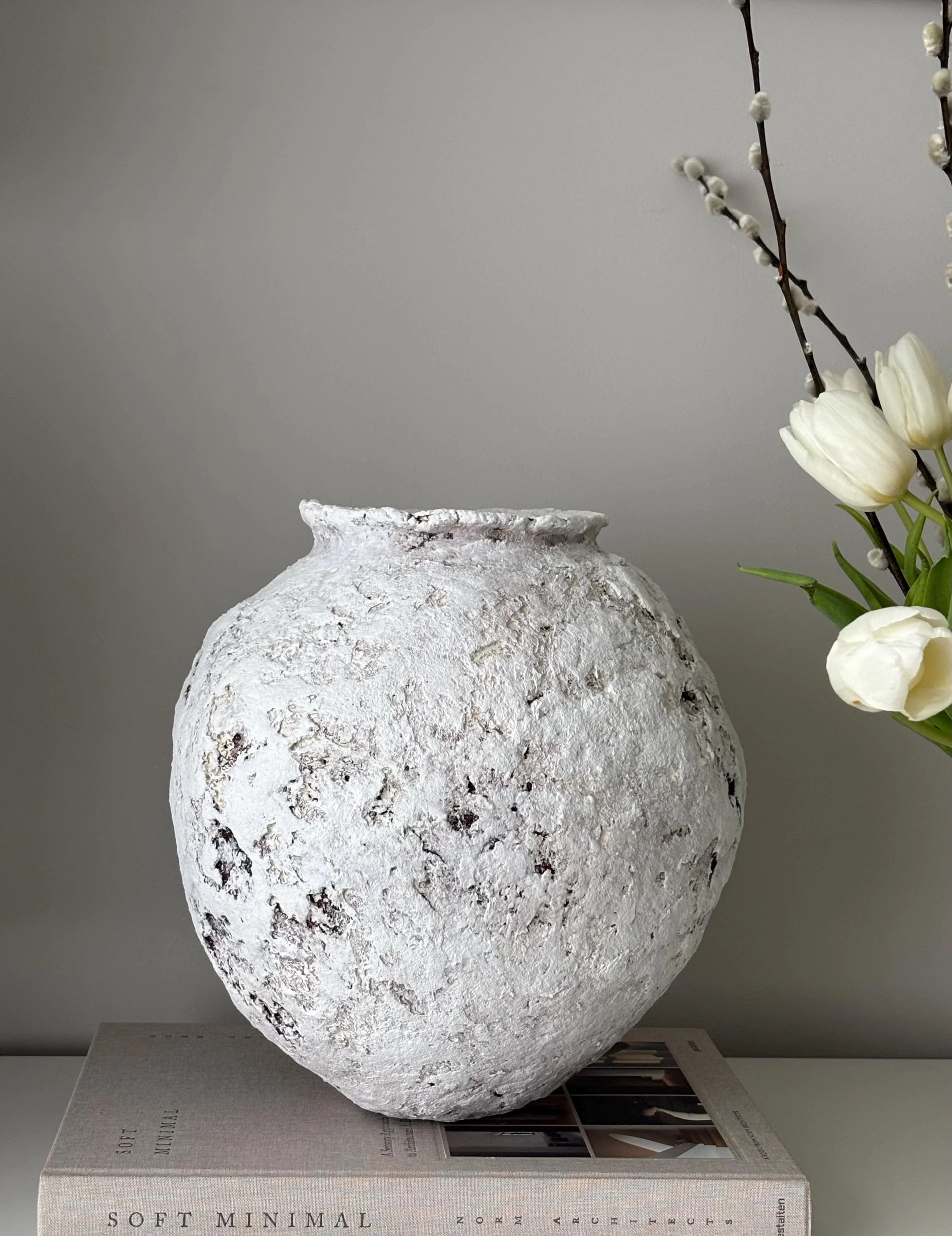 Oval Vessel N.26, handmade white paper clay vessel, aged textured surface, front view. Papier Atelier London