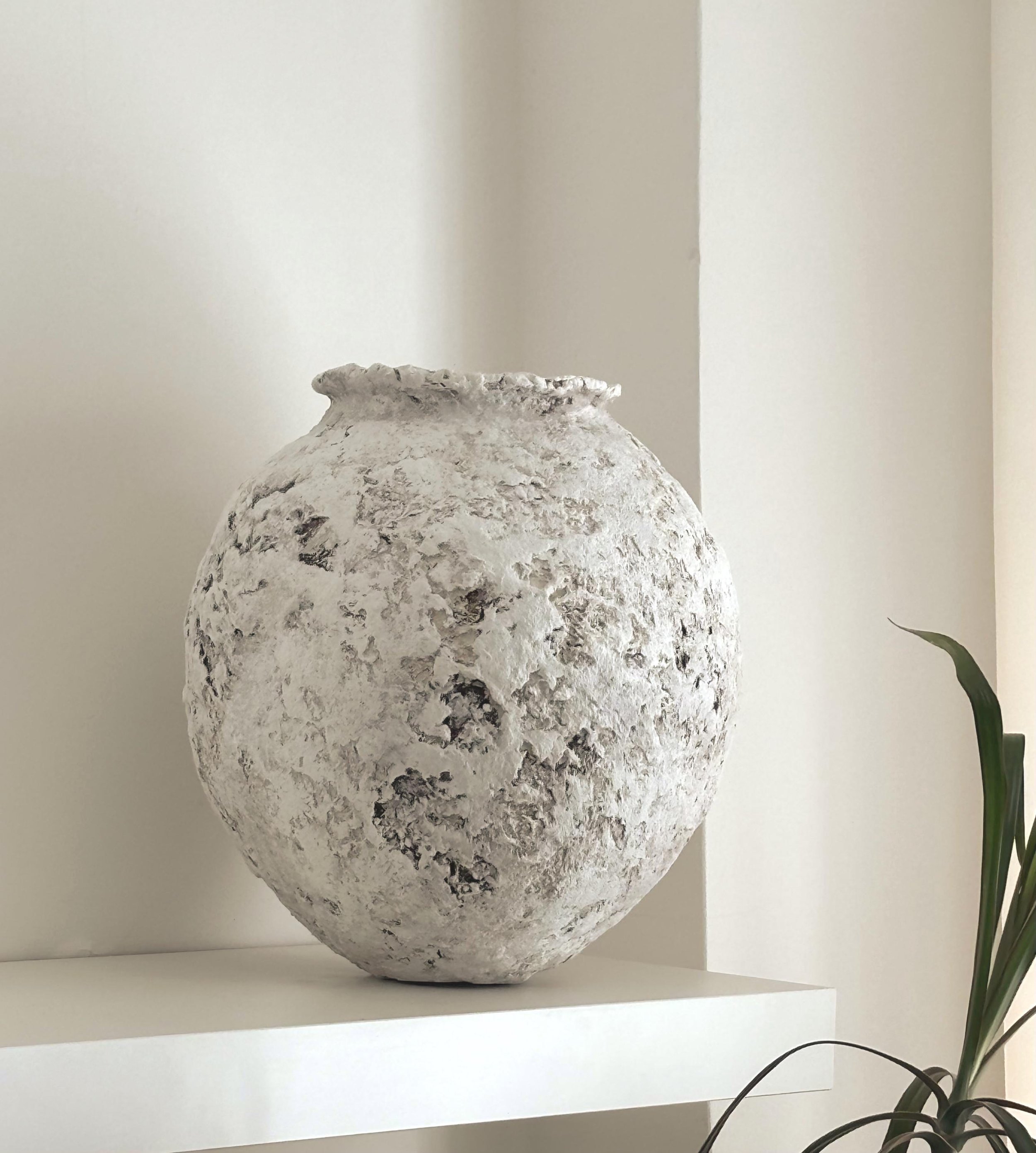 Oval Vessel N.26, handmade white paper clay vessel, aged textured surface, side view. Papier Atelier London