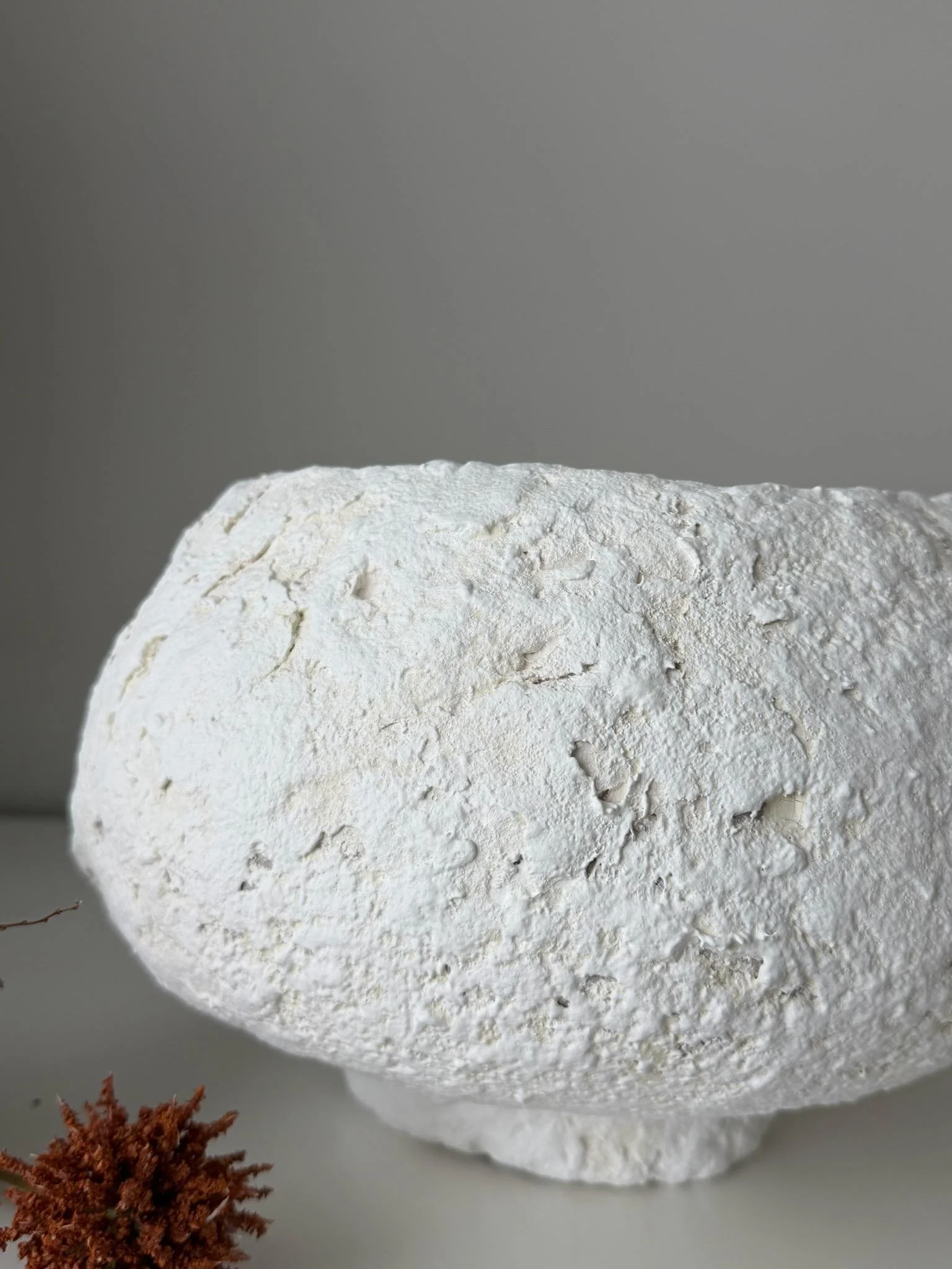 Footed Bowl N.27, handmade white paper clay bowl, on a low foot, side view. Papier Atelier London