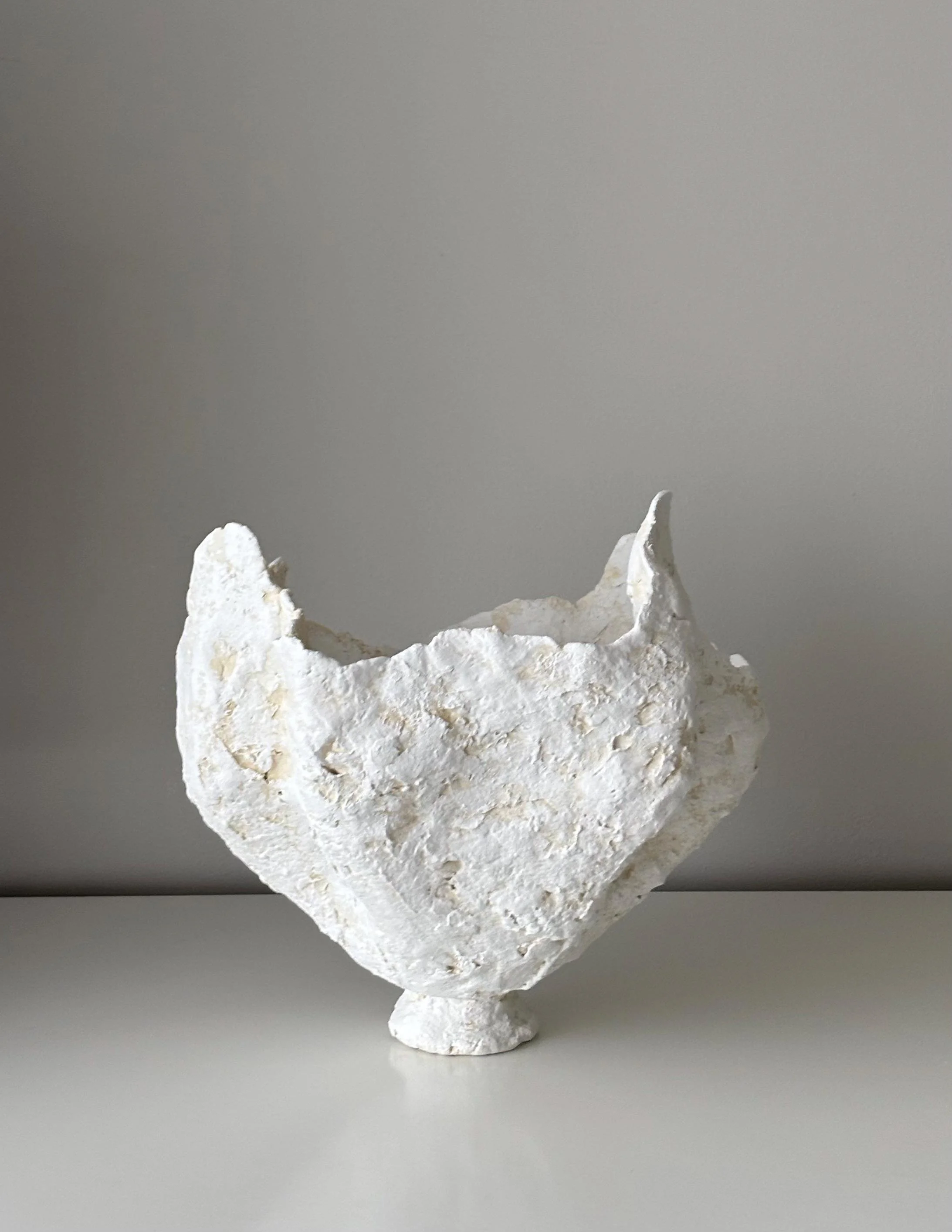Petal Vase N.29, handmade white paper clay vase, wavy petal-like rim, another angle. Papier Atelier London