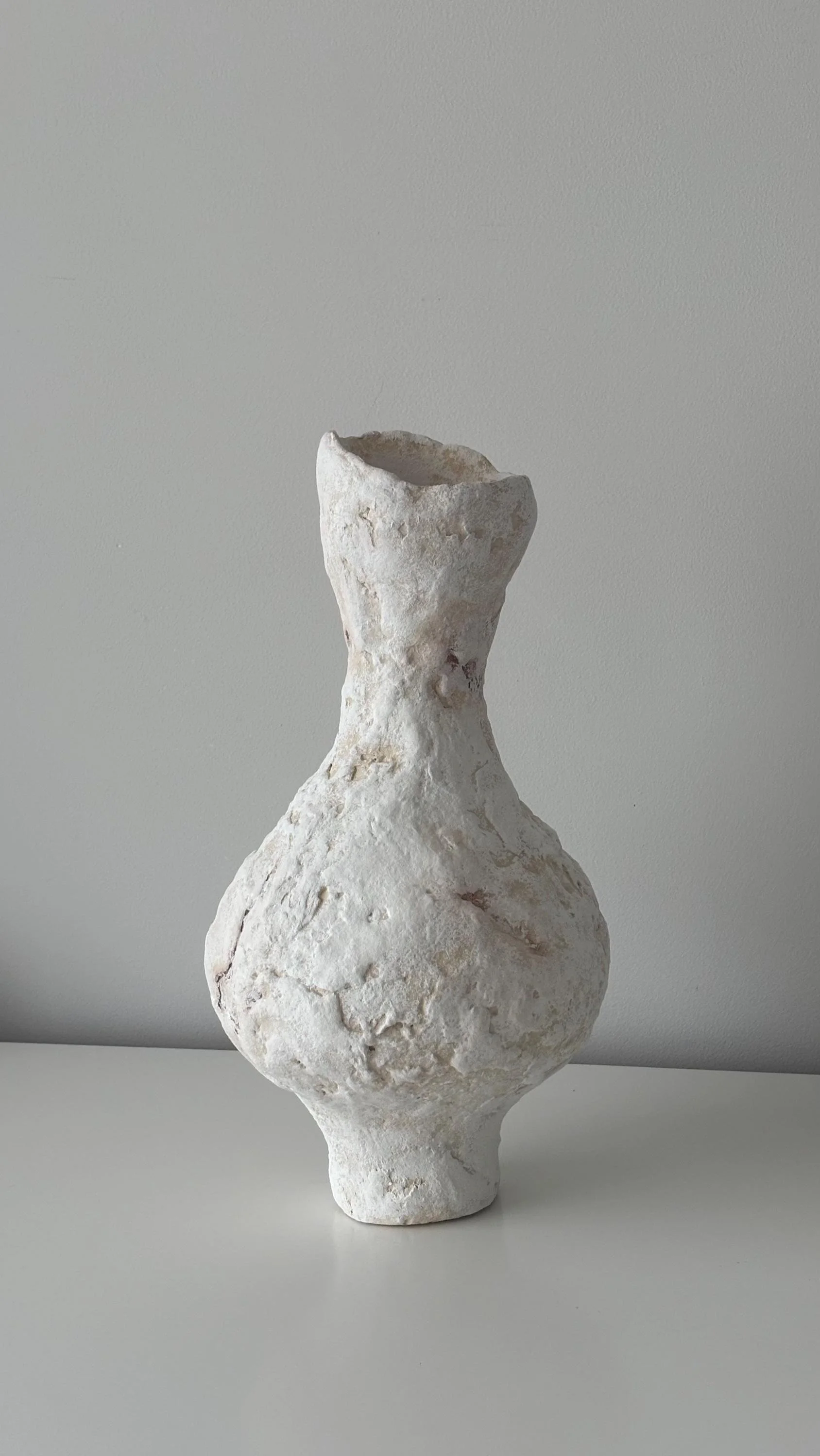 Tall Vase N.31, handmade tall paper clay vase, flared opening and relief, front view. Papier Atelier London