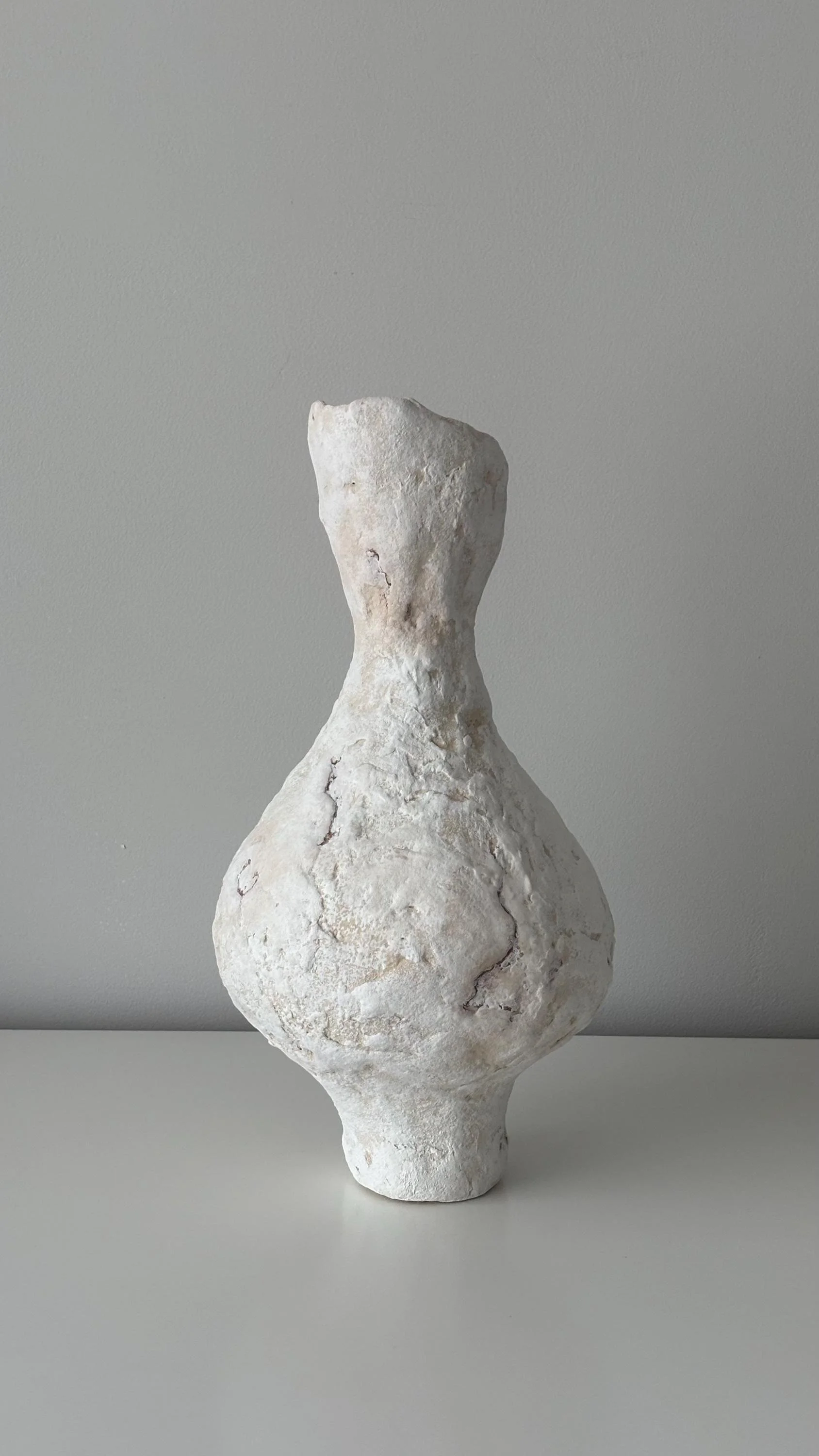 Tall Vase N.31, handmade tall paper clay vase, flared opening and relief, side view. Papier Atelier London