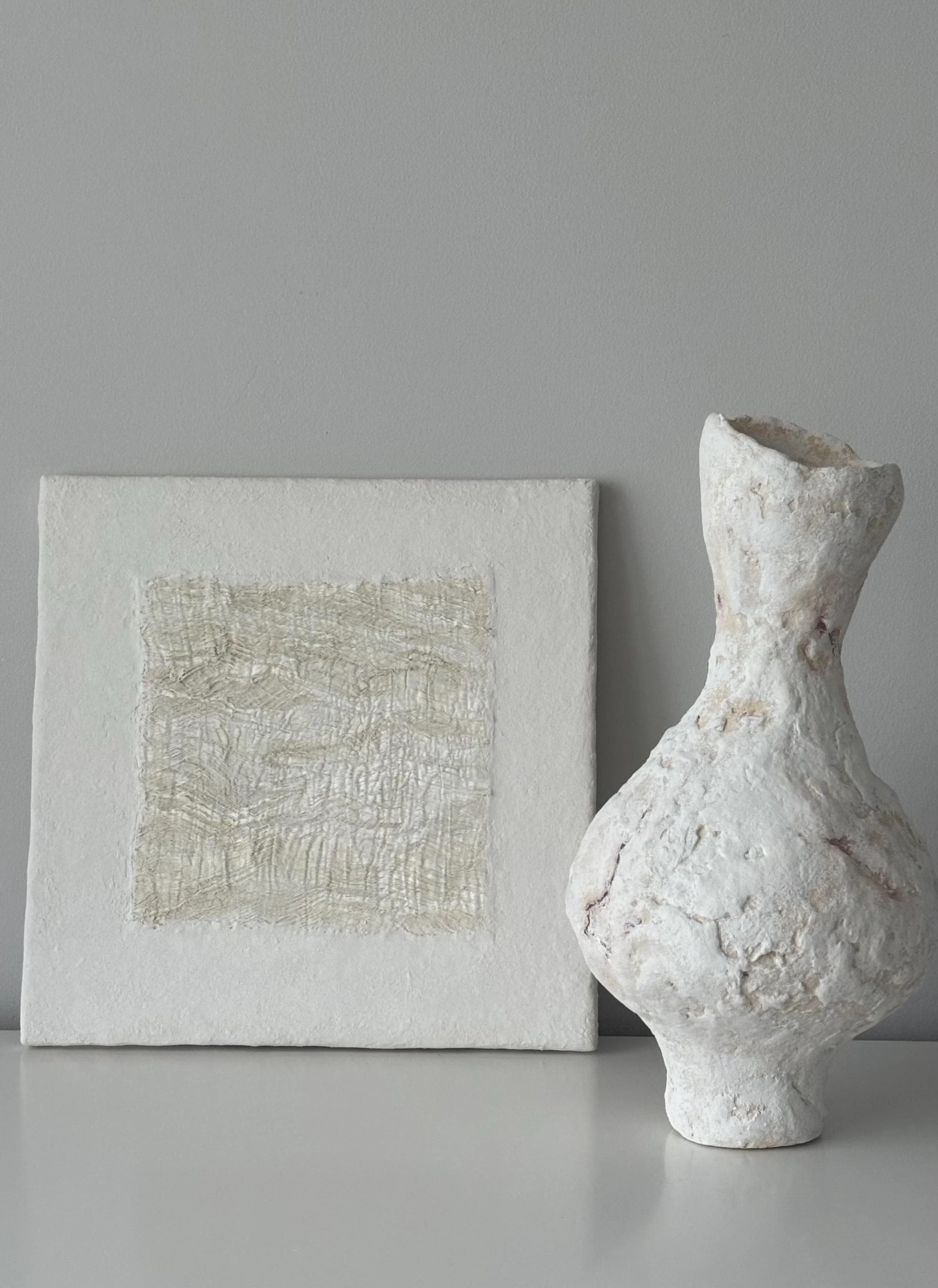 Tall Vase N.31, handmade tall paper clay vase, flared opening and relief, detail. Papier Atelier London