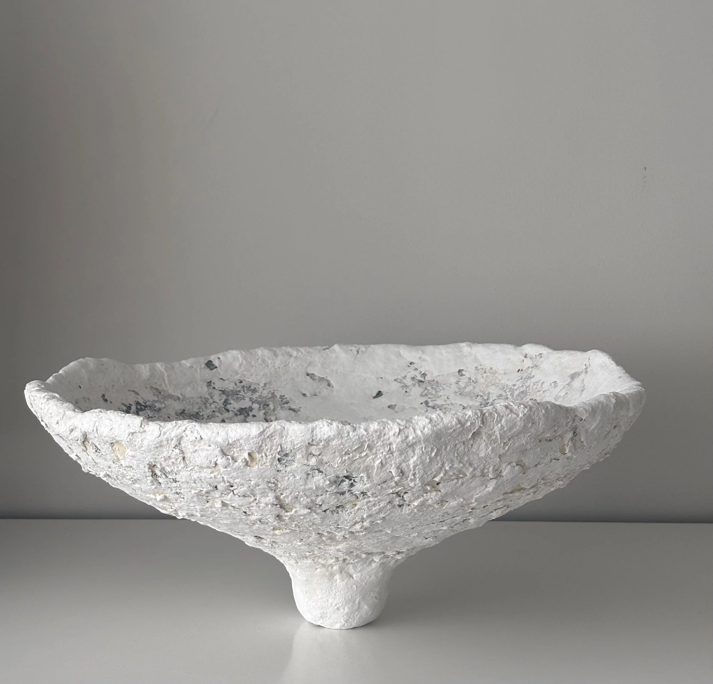 Large Bowl N.34, handmade large white paper clay bowl, on a slender foot, front view. Papier Atelier London