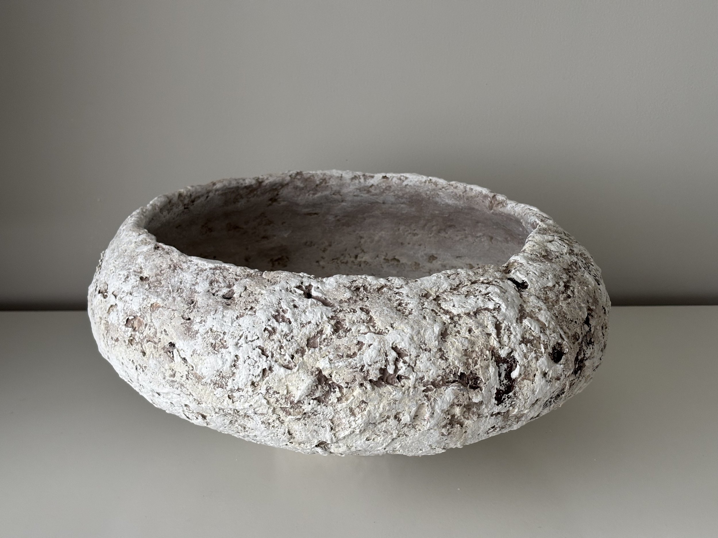 Large Textured Bowl N.5, off-white paper clay bowl viewed from an alternate angle highlighting asymmetrical shape, from Papier Atelier London