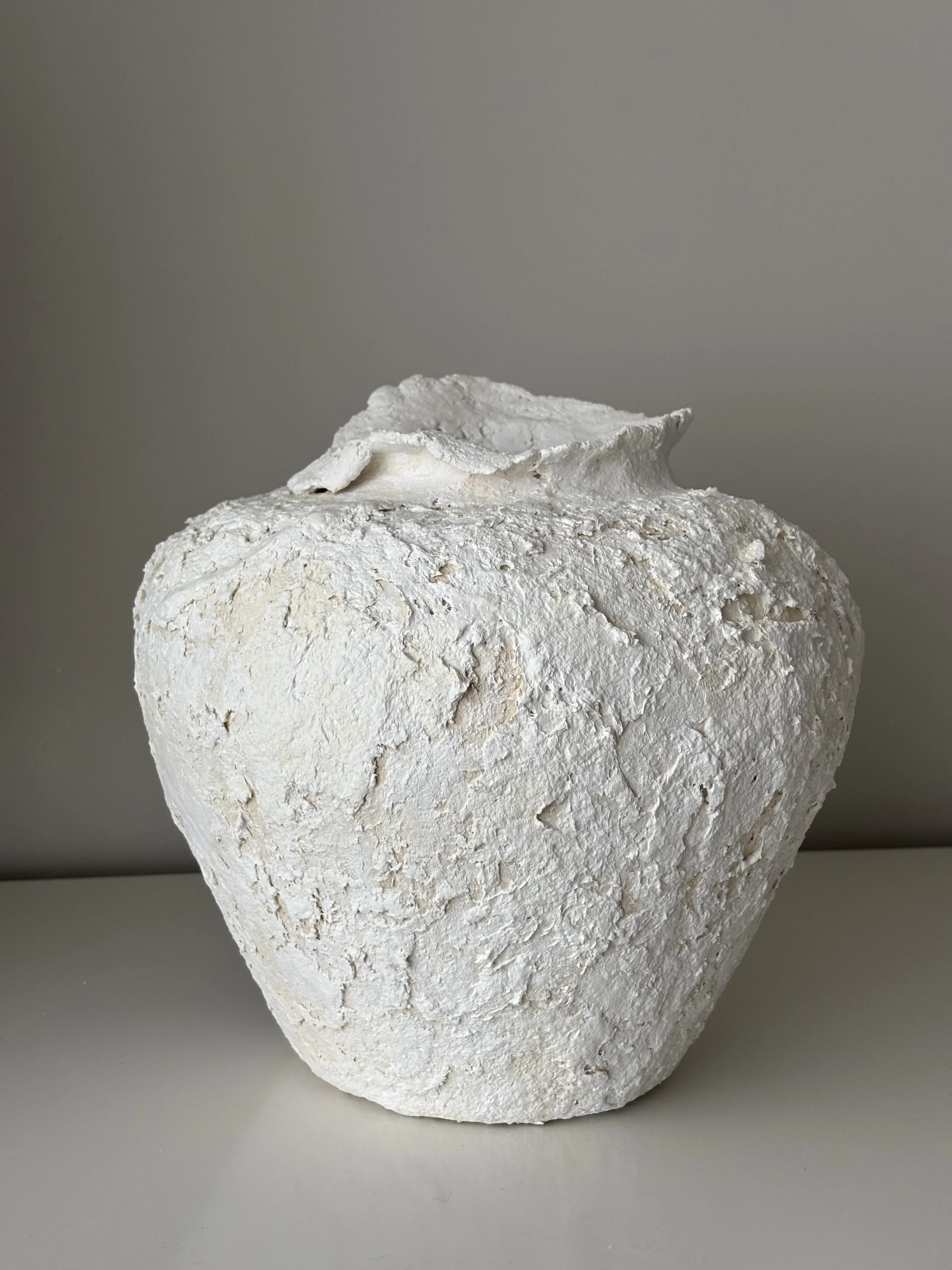 Side profile of Wabi Sabi Neutral Tones Vessel N.2 in Wabi-Sabi inspired paper clay, showing the sculptural silhouette and textured surface, London atelier