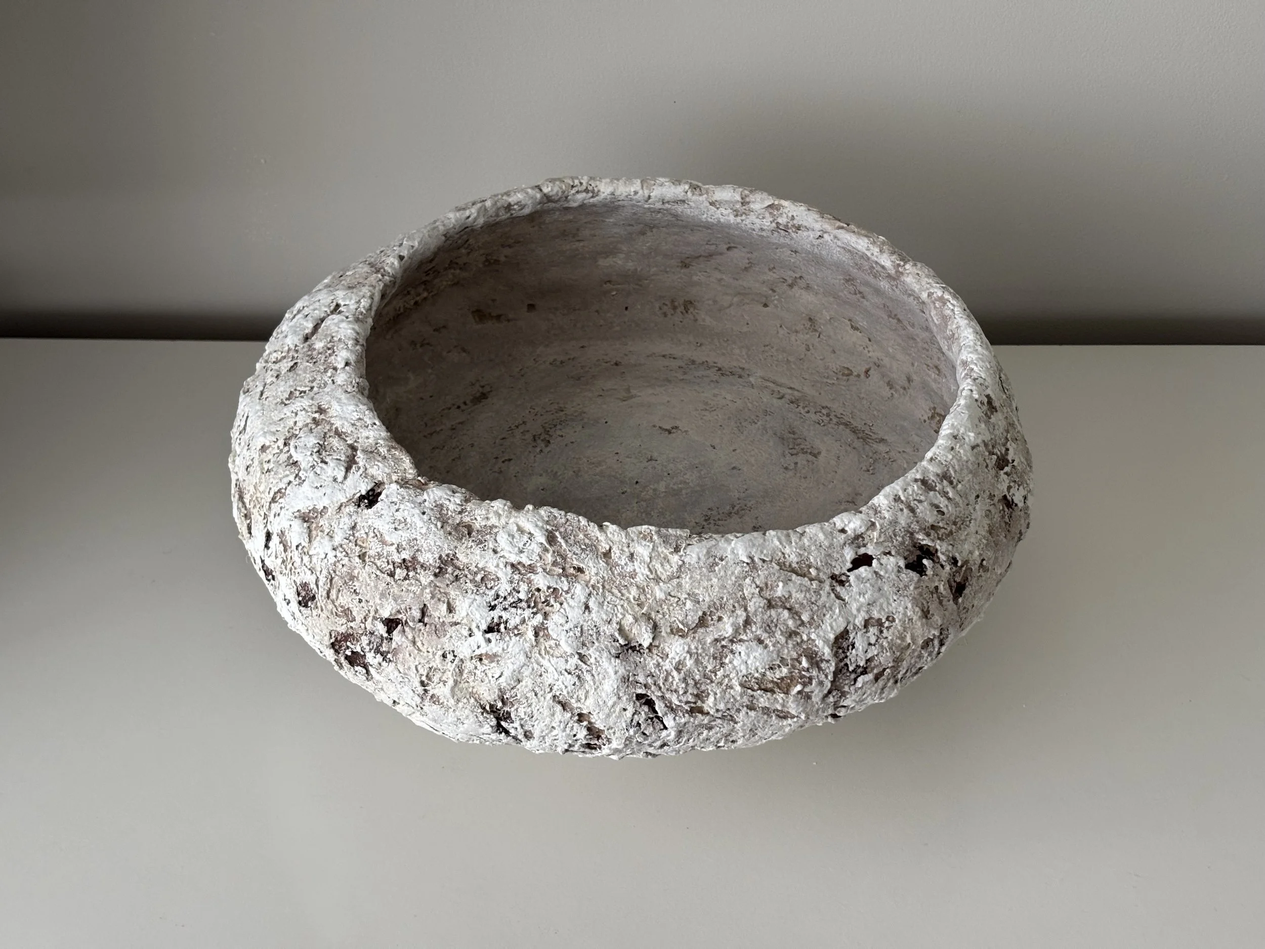 Close-up detail of Large Textured Bowl N.5 surface texture, showing textured paper clay imperfections and Wabi-Sabi character, minimalist sculptural home decor