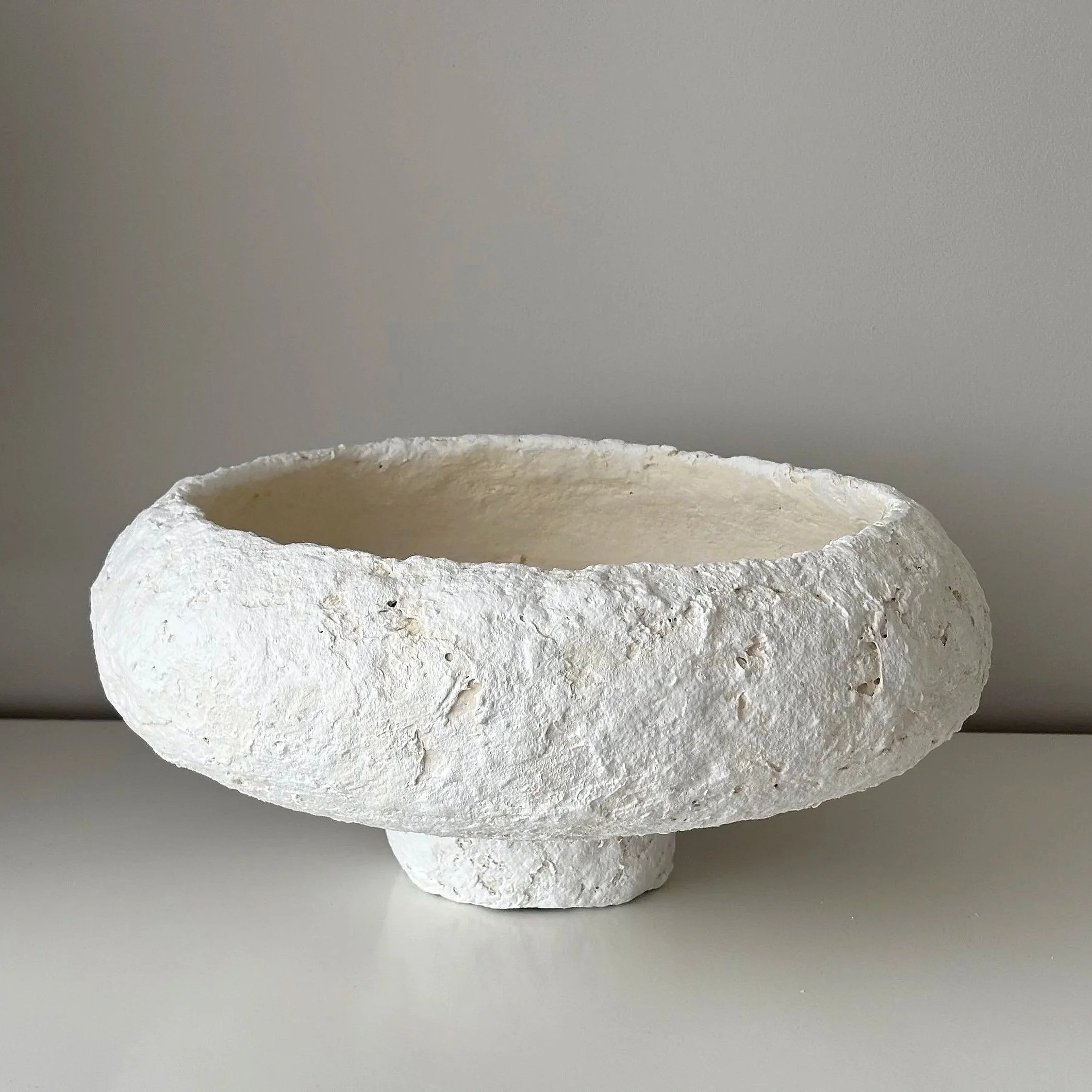 Large Textured Bowl N.23, white paper clay bowl viewed from an alternate angle highlighting asymmetrical shape, from Papier Atelier London