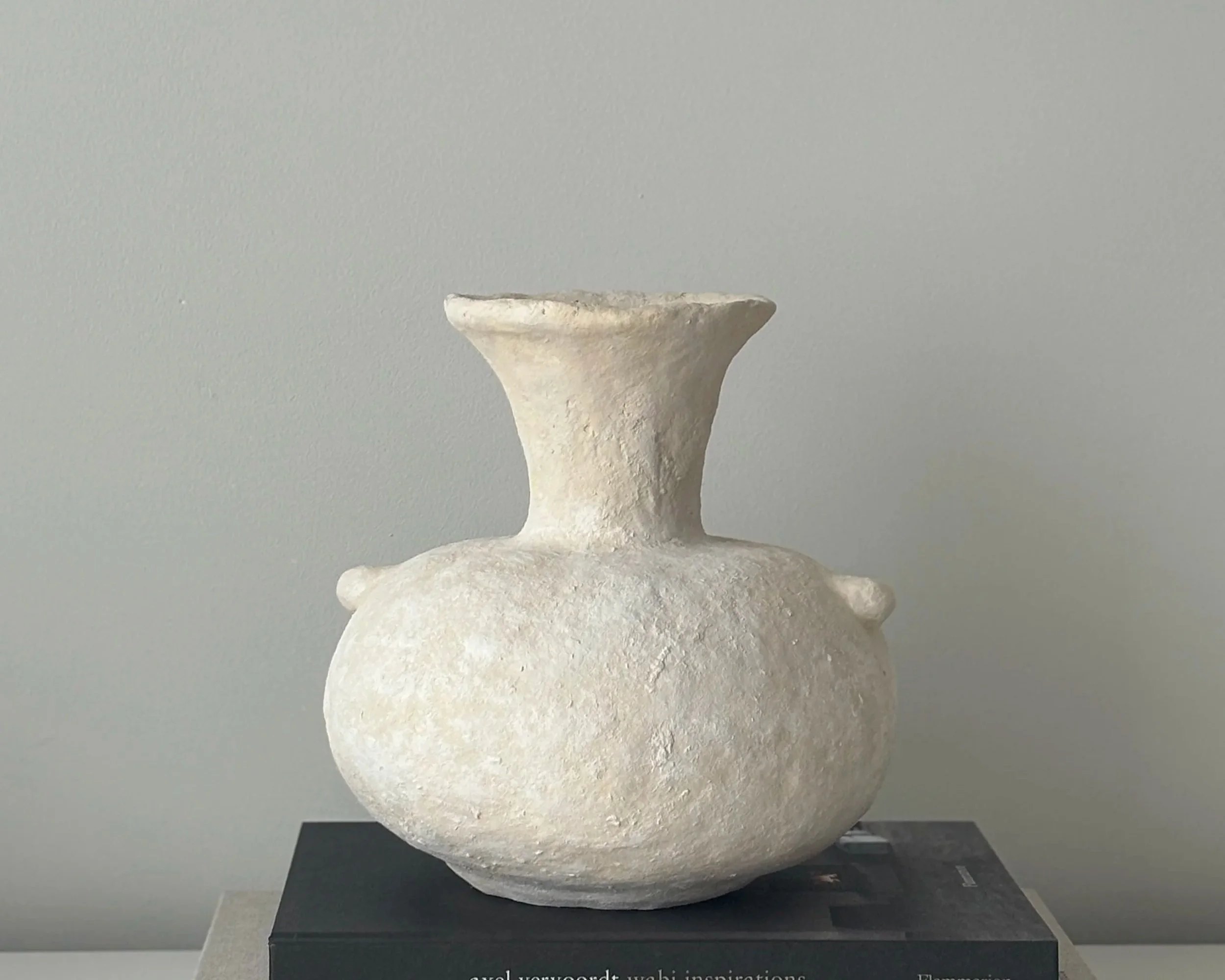 Side profile of Ecru Vase N.71 in Wabi-Sabi inspired paper clay, showing the sculptural silhouette and textured surface, London atelier
