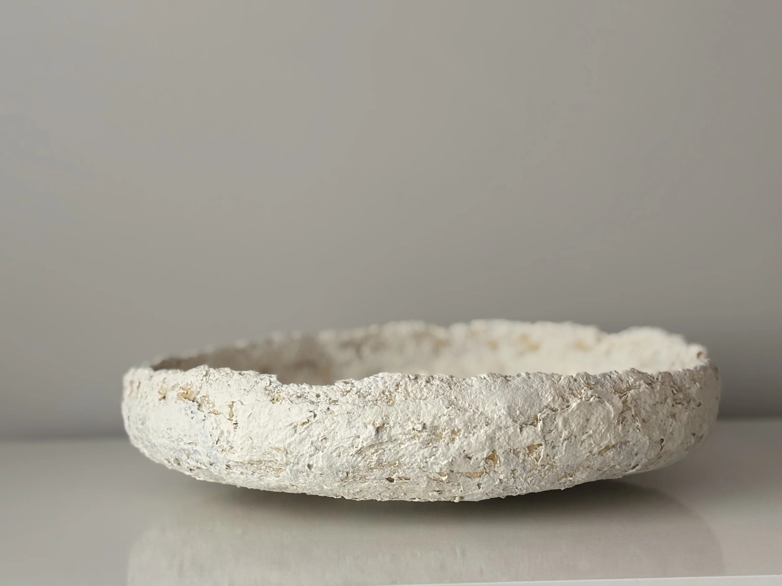 Layered Tray N.19 styled in a contemporary interior, handcrafted handcrafted paper clay tray with organic textured finish