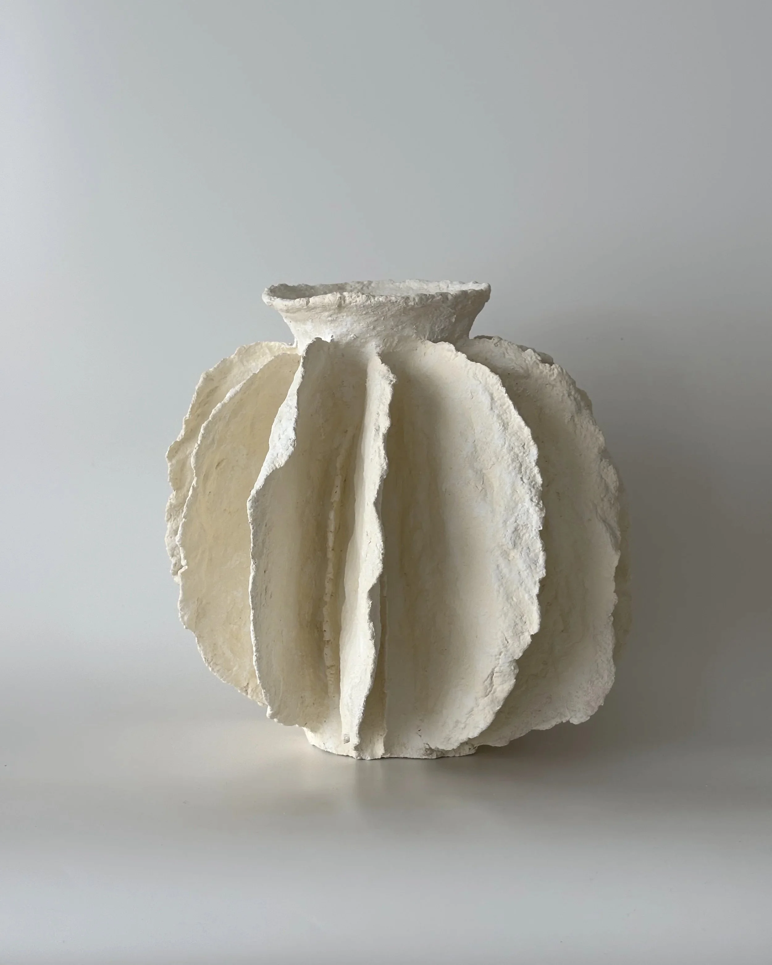 Pleated Vessel N.43, handmade paper clay vessel, side view. Papier Atelier London