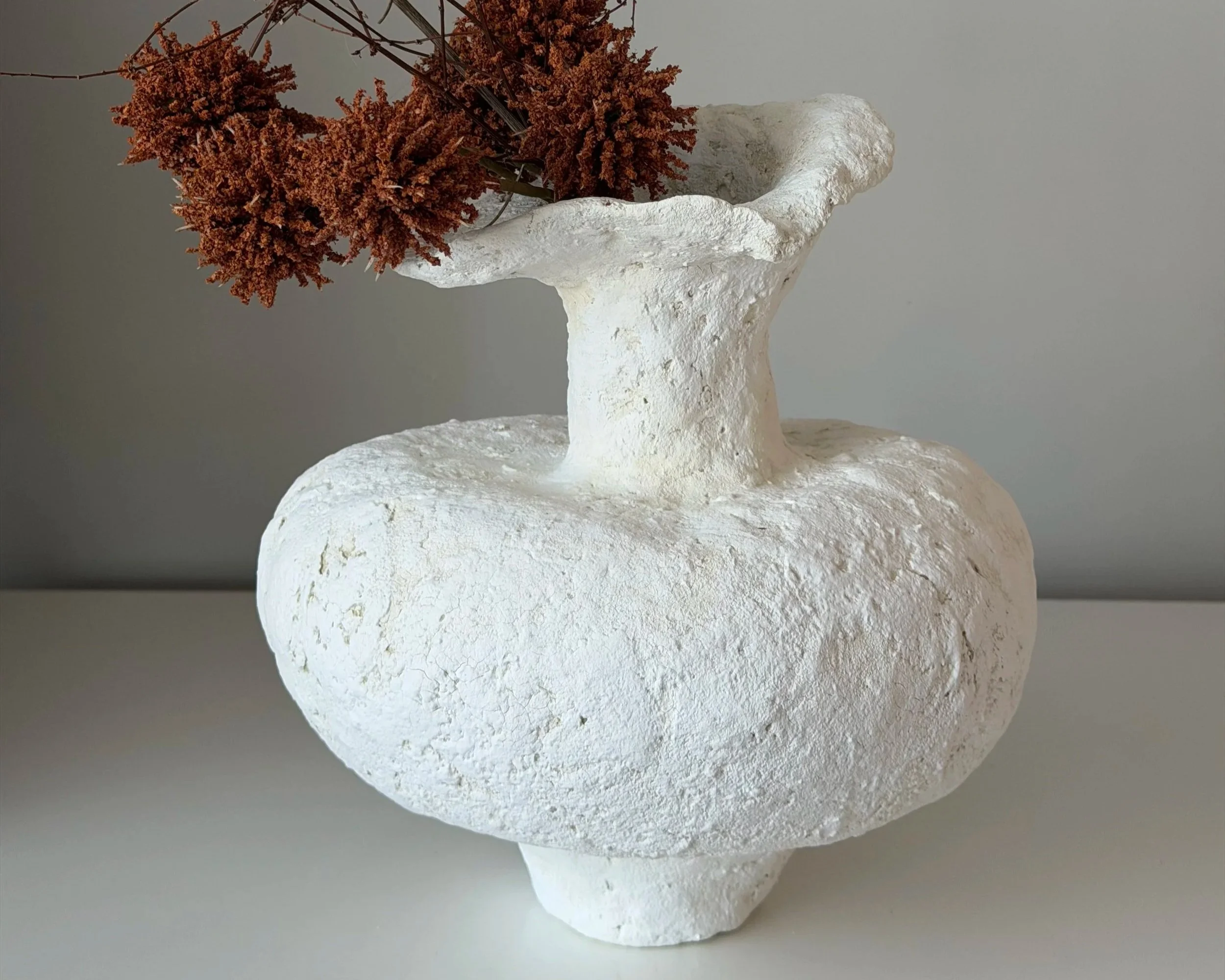 Asymmetric Vessel N.48 — Side Angle White paper clay vessel, side view showing wide body and narrow neck, handmade by Papier Atelier London