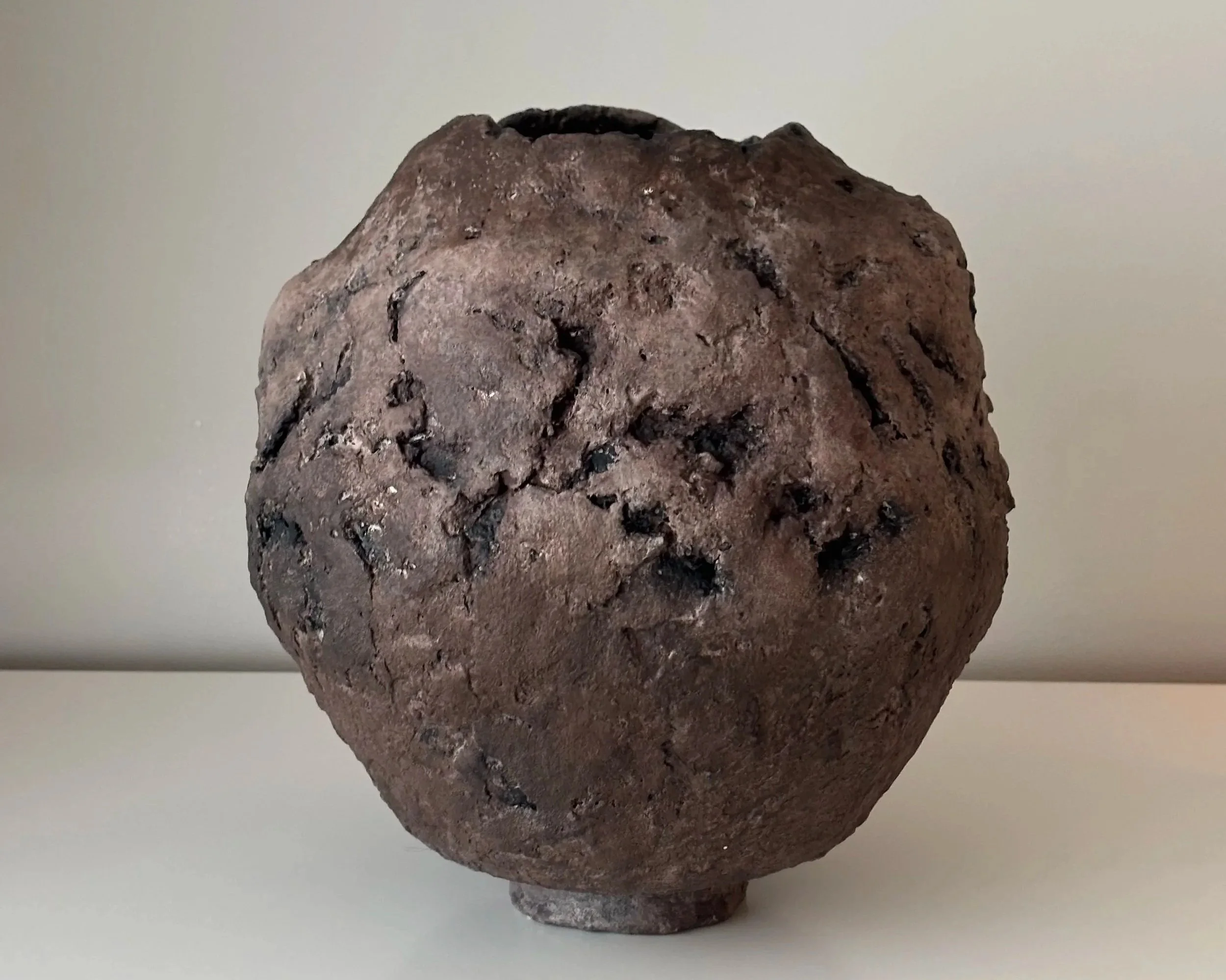 Close-up detail of Textured Vessel N.3 surface texture, showing textured paper clay imperfections and Wabi-Sabi character, minimalist sculptural home decor