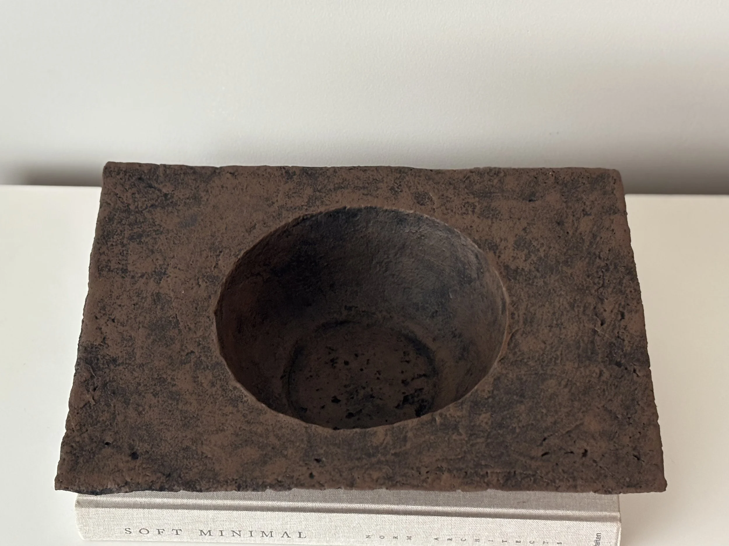 Wabi Sabi Rectangular Bowl N.7, off-white paper clay bowl viewed from an alternate angle highlighting asymmetrical shape, from Papier Atelier London