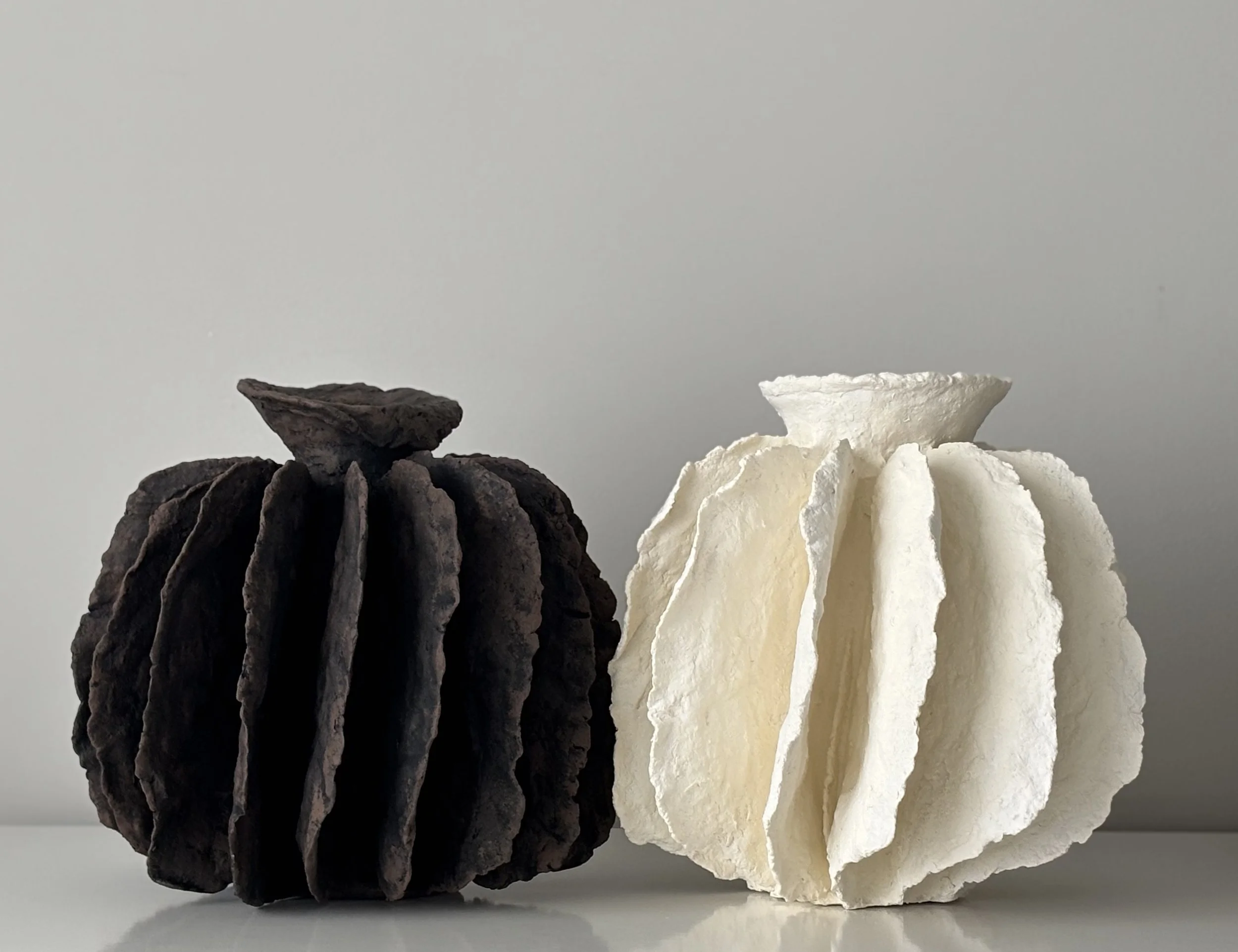 Textured Pleated Vessel N.8 styled in a contemporary interior, handcrafted textured paper clay vessel with organic textured finish