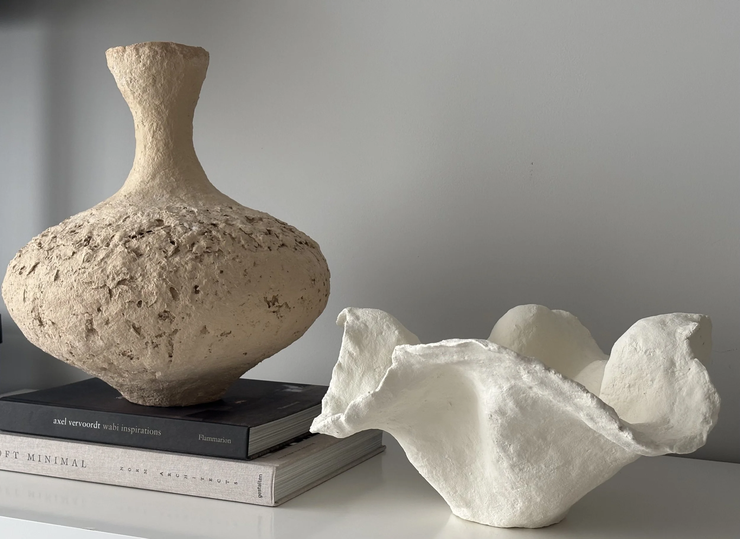 Wabi Sabi Vase N.6 displayed in a styled setting, off-white Wabi-Sabi inspired paper clay vase as minimalist sculptural home decor