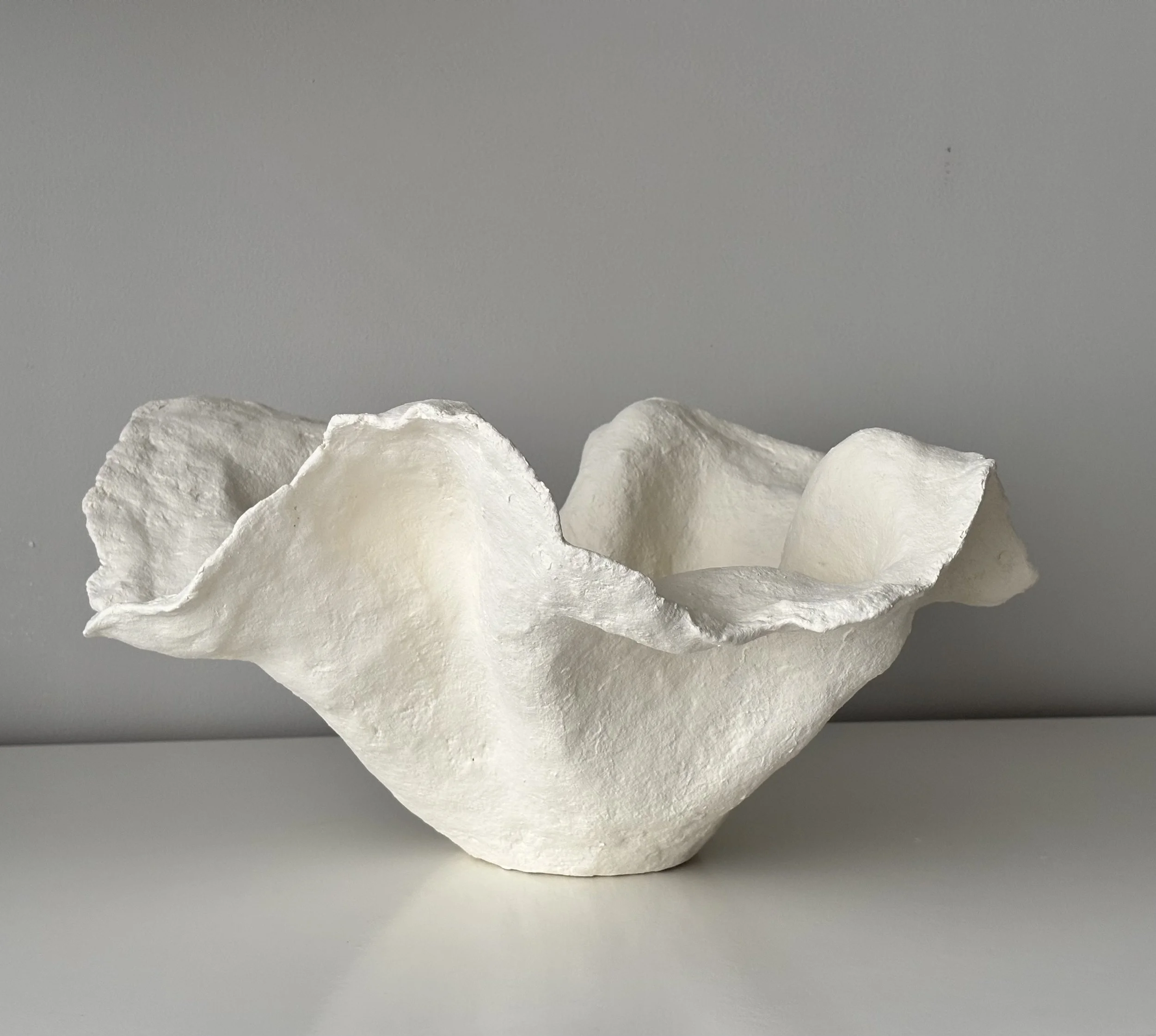 Close-up detail of Handkerchief White Bowl N.33 surface texture, showing sculptural paper clay imperfections and Wabi-Sabi character, unique handcrafted pottery