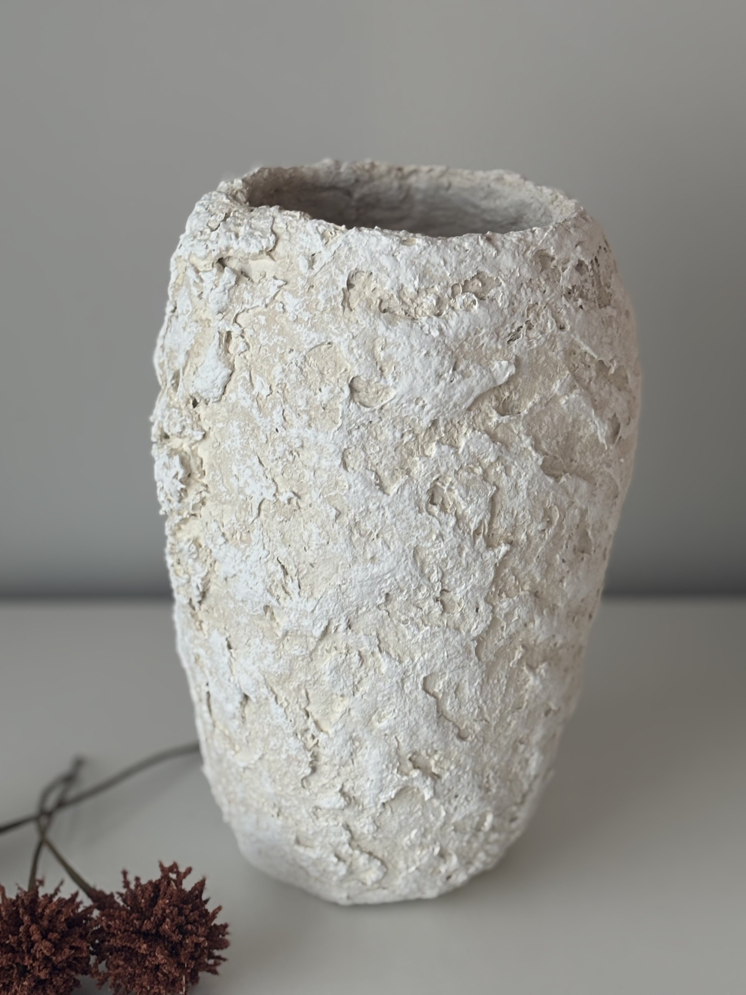 Side profile of Ecru And White Tones Textured Vase N.13 in Wabi-Sabi inspired paper clay, showing the sculptural silhouette and textured surface, London atelier