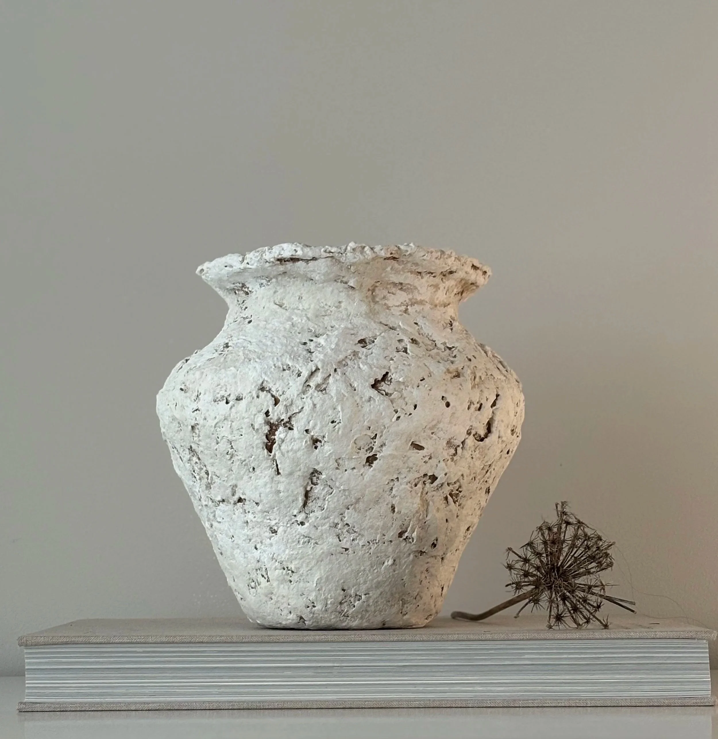Side profile of Sculptural Vase N.61 in Wabi-Sabi inspired paper clay, showing the sculptural silhouette and textured surface, London atelier