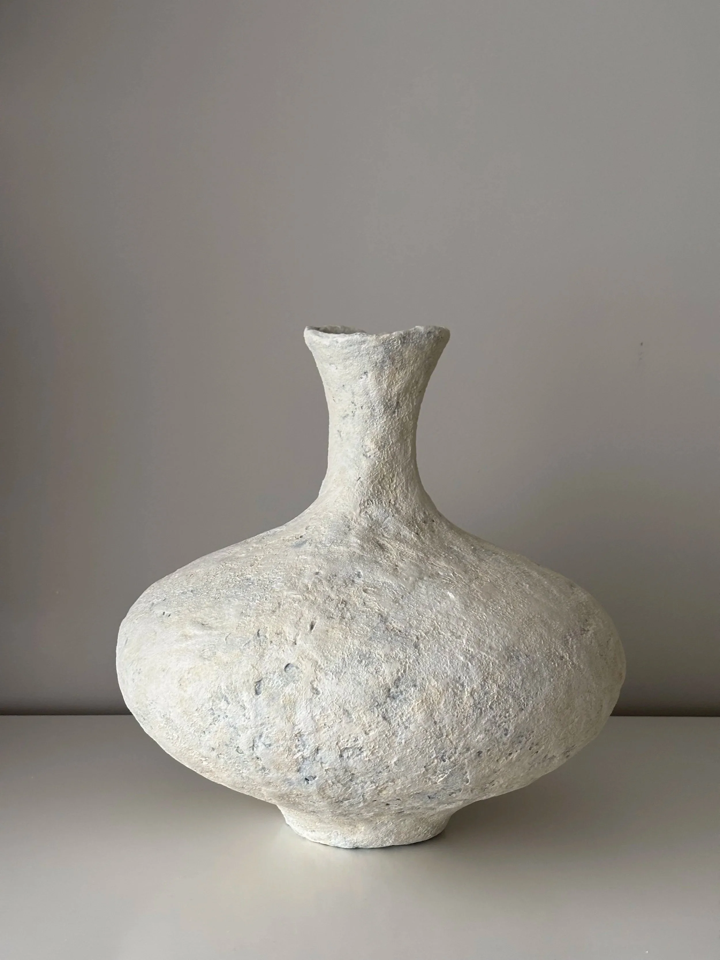 Side profile of Contemporary Neutral Tones Vessel N.16 in Wabi-Sabi inspired paper clay, showing the sculptural silhouette and textured surface, London atelier