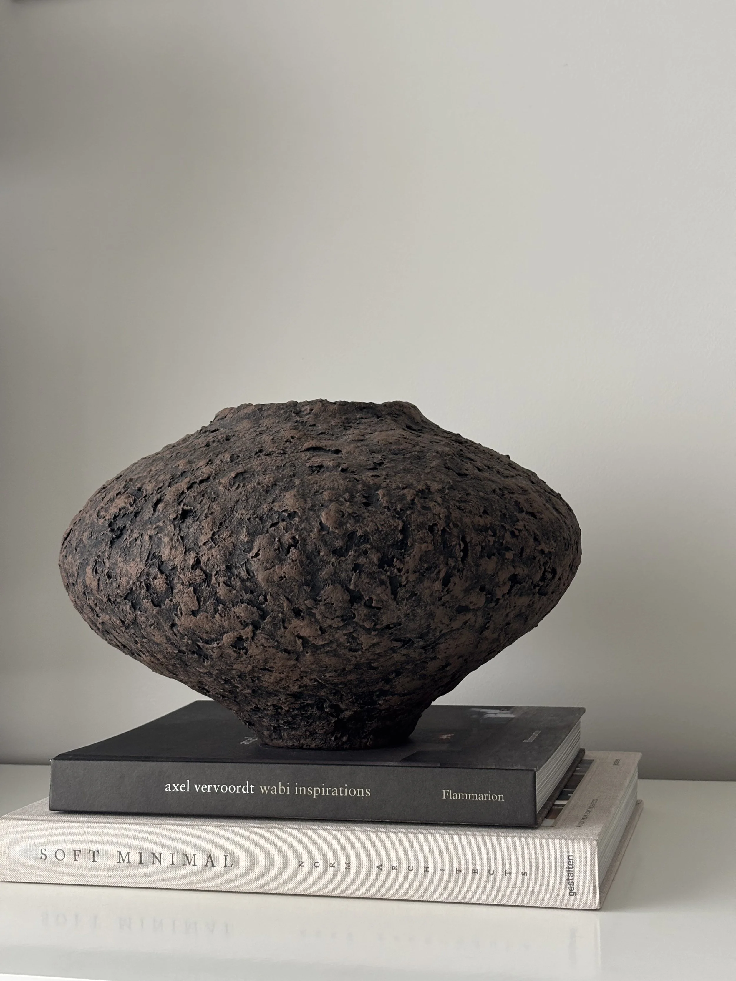 Wabi Sabi Vase N.44 from an angled perspective, off-white handcrafted paper clay vase with irregular organic edges, handmade in London