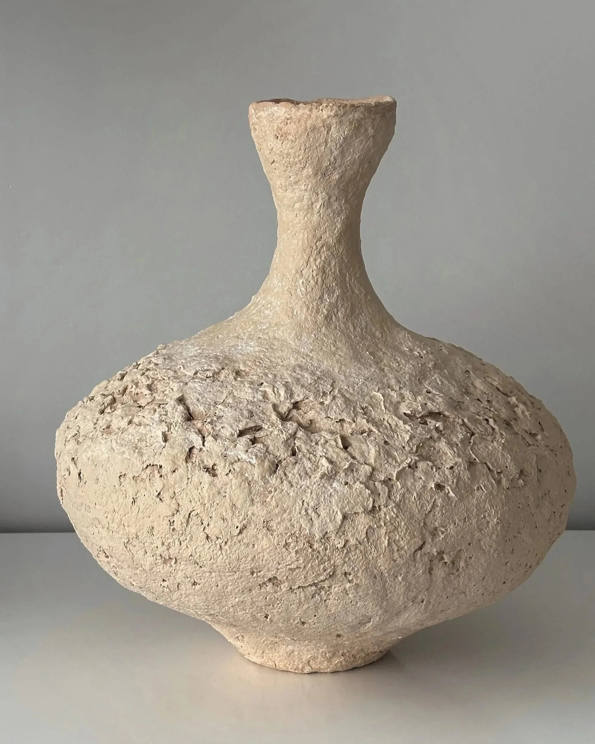 Wabi Sabi Vase N.6, off-white paper clay vase viewed from an alternate angle highlighting asymmetrical shape, from Papier Atelier London