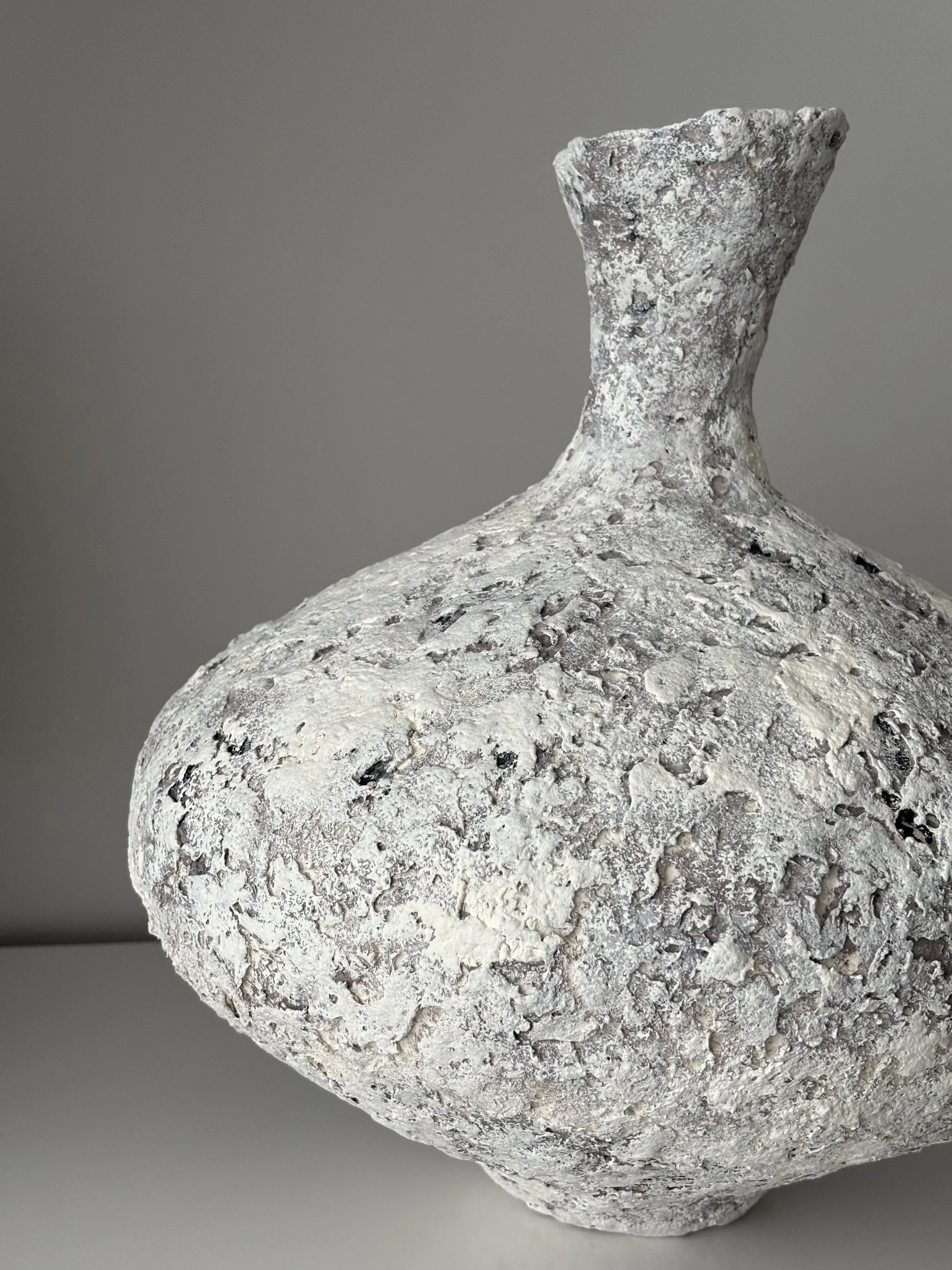 Rear view of Wabi Sabi Vase N.11 in off-white Wabi-Sabi inspired paper clay, showing organic asymmetry from behind, London atelier