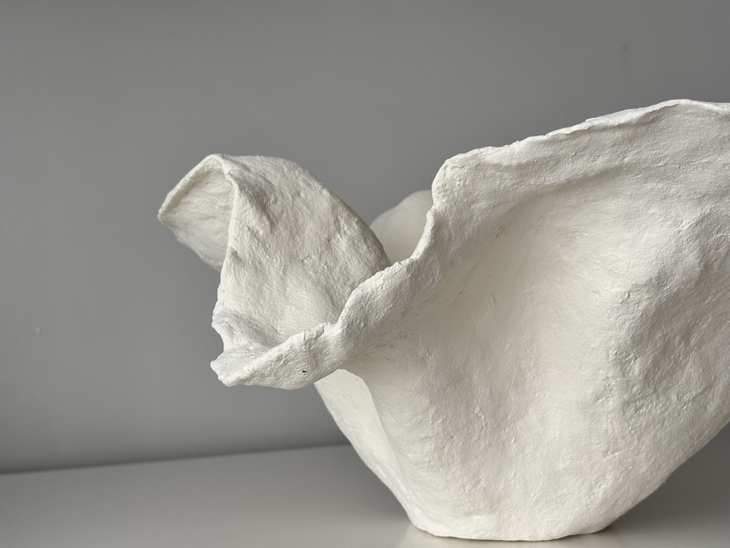 Handkerchief White Bowl N.33 from an angled perspective, white handcrafted paper clay bowl with irregular organic edges, handmade in London
