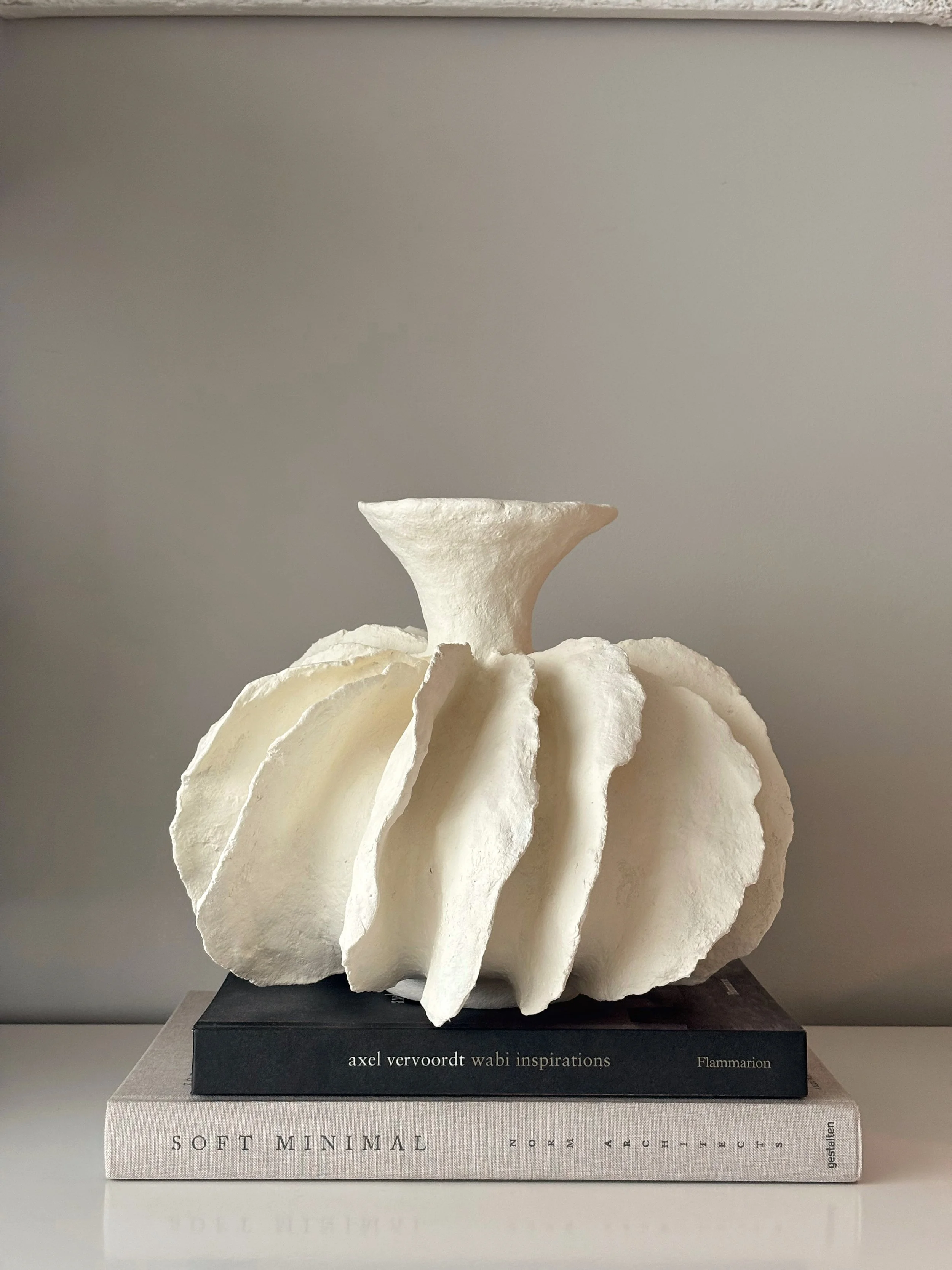 White Pleated Sculpture Vase N.12 in white handcrafted paper clay, front view showing organic form and textured matte finish, handmade in London