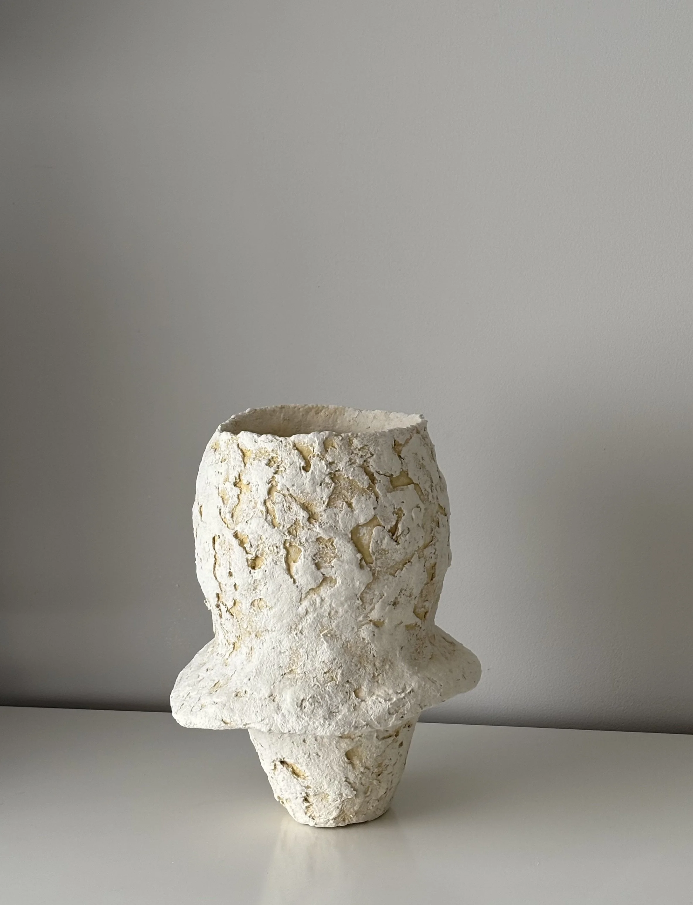 Rear view of Textured Vase N.24 in off-white paper clay, showing organic asymmetry from behind, from Papier Atelier London