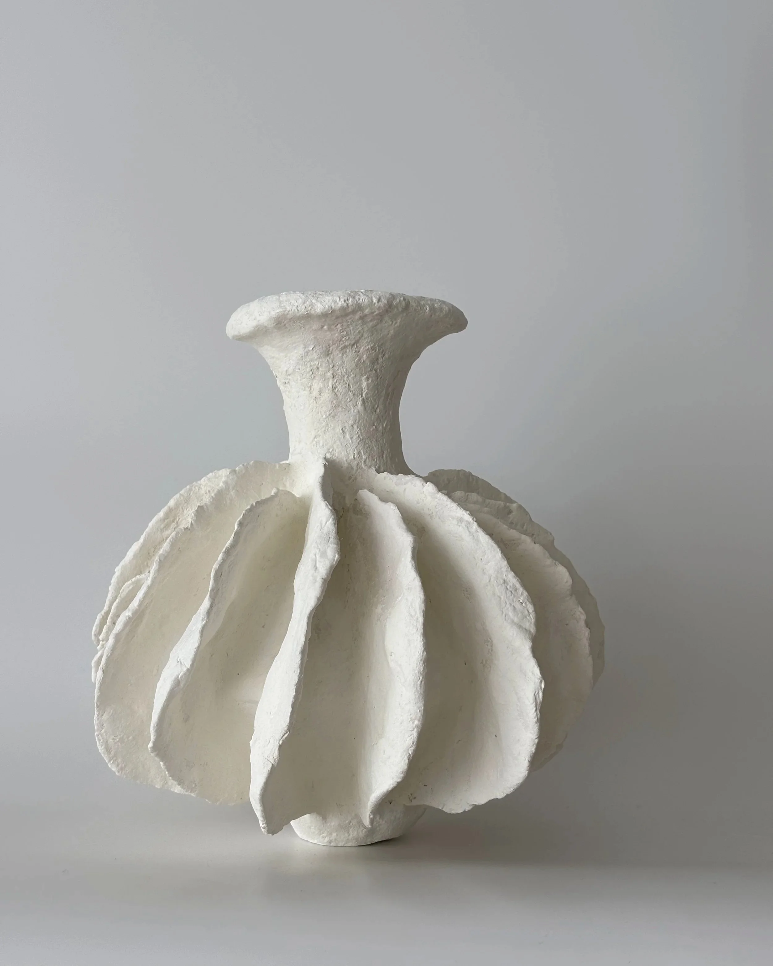 Pleated Vase N.28, handmade paper clay vase, side view. Papier Atelier London