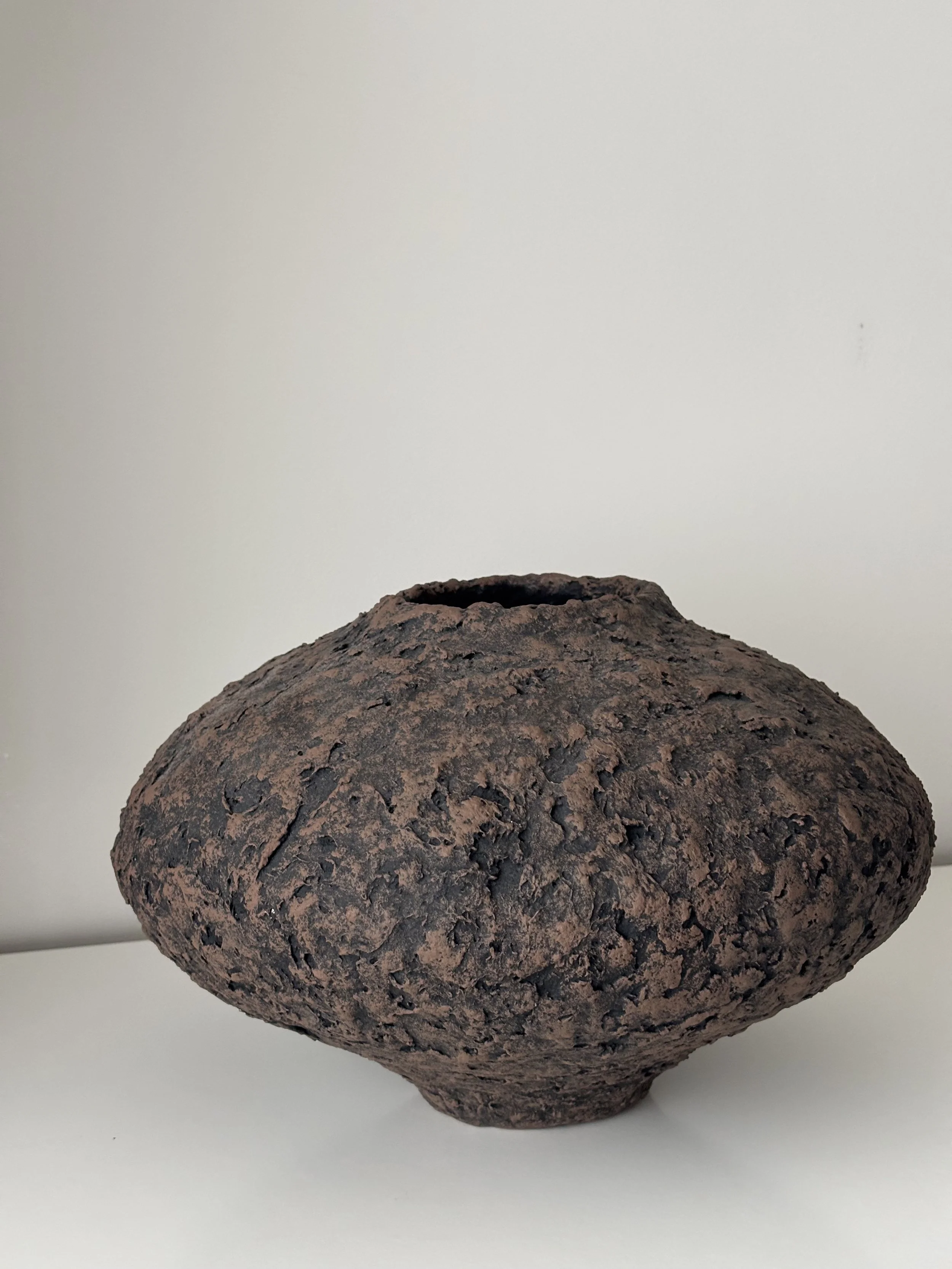 Side profile of Wabi Sabi Vase N.44 in Wabi-Sabi inspired paper clay, showing the sculptural silhouette and textured surface, London atelier