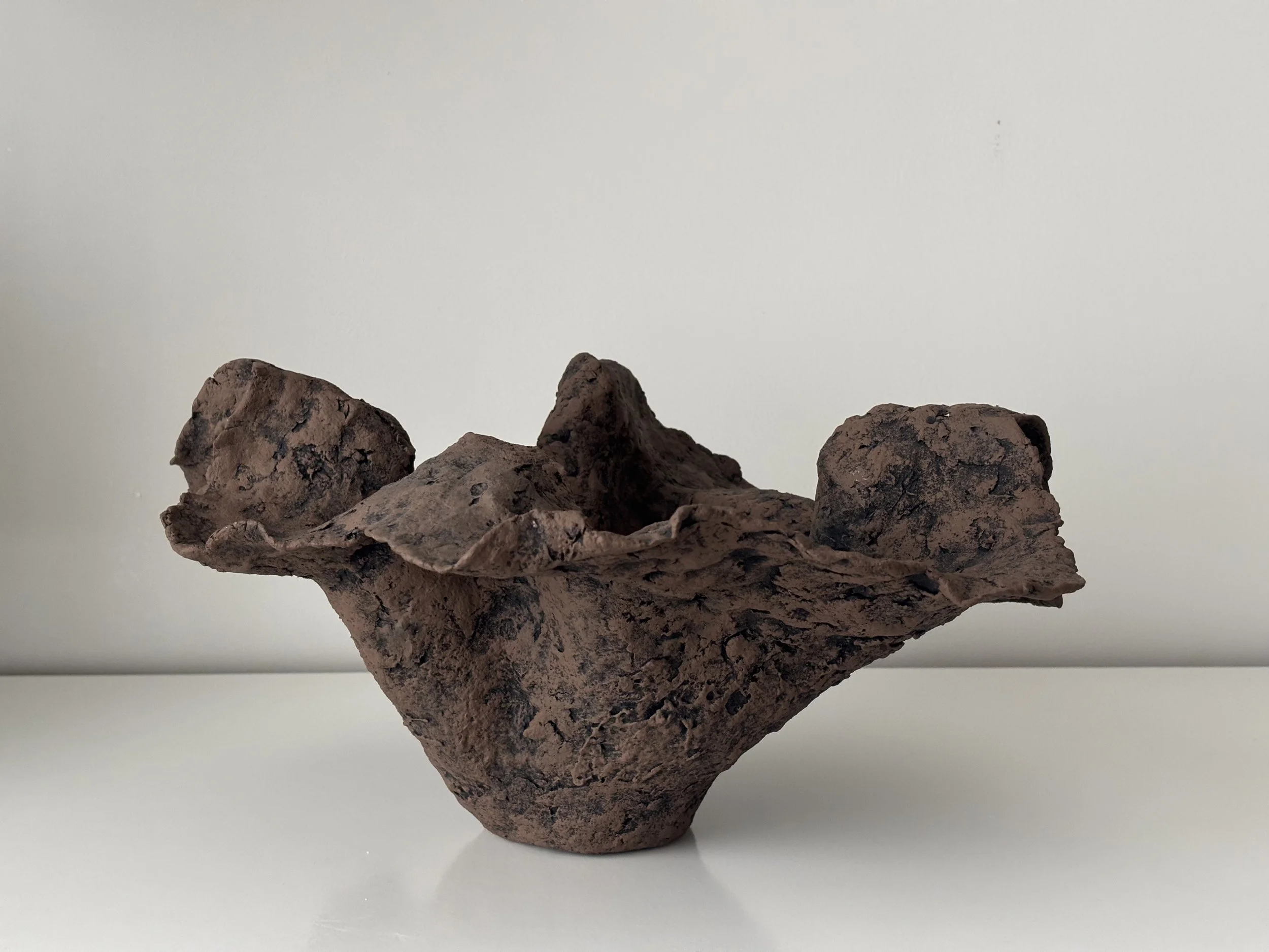 Handkerchief Bowl N.51 from an angled perspective, dark brown & off-white paper clay bowl with irregular organic edges, from Papier Atelier London