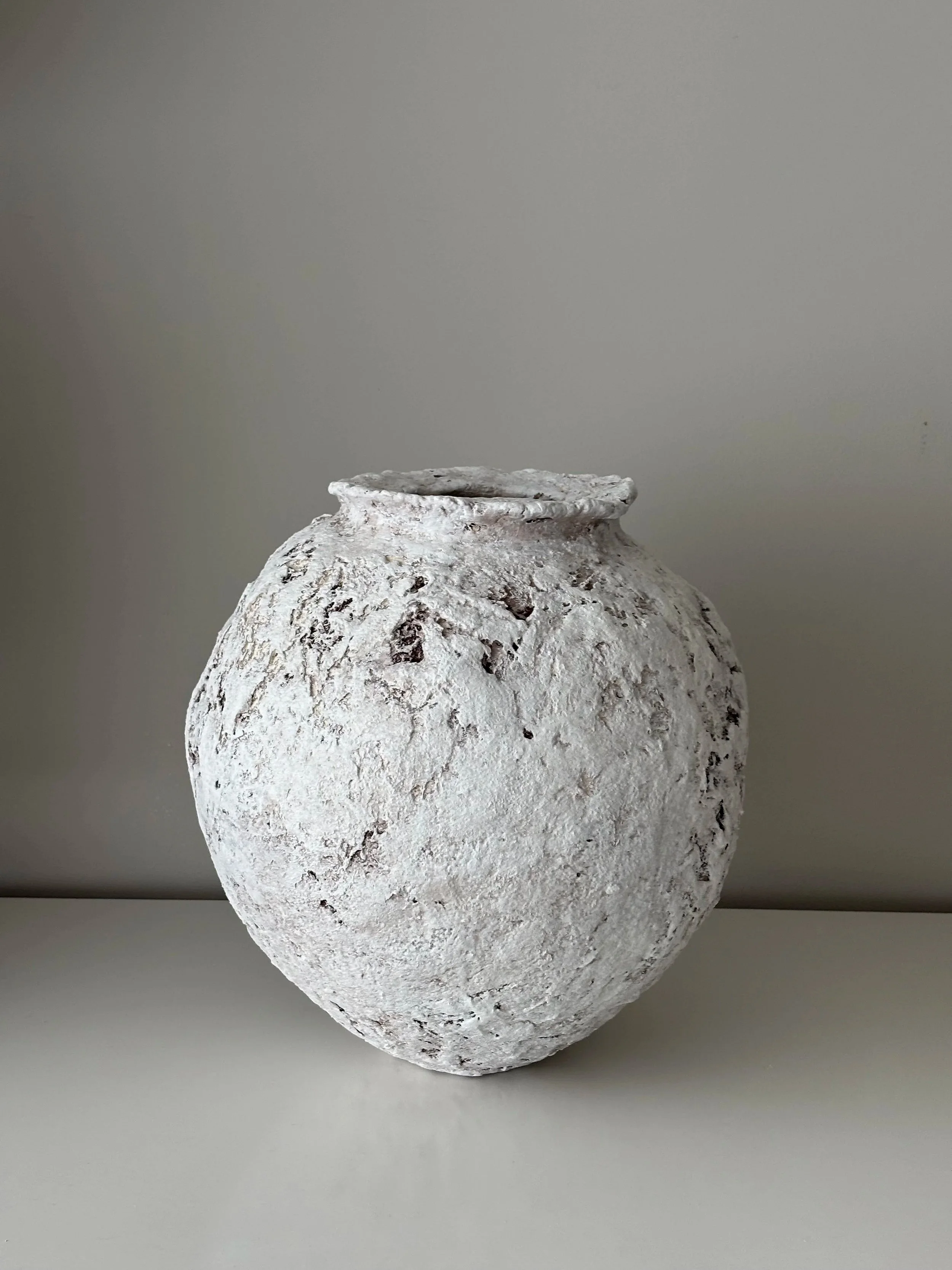Side profile of Wabi Sabi Textured Vessel N.49 in Wabi-Sabi inspired paper clay, showing the sculptural silhouette and textured surface, London atelier