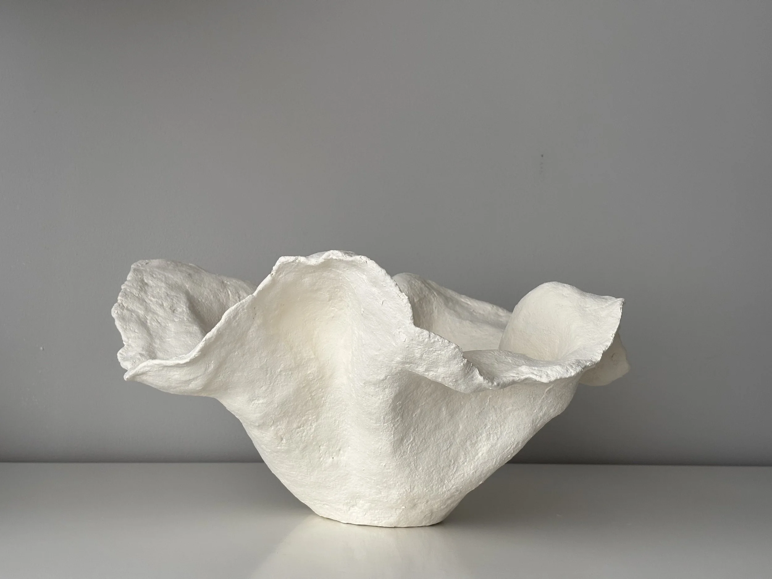Handkerchief White Bowl N.33, white paper clay bowl viewed from an alternate angle highlighting asymmetrical shape, from Papier Atelier London