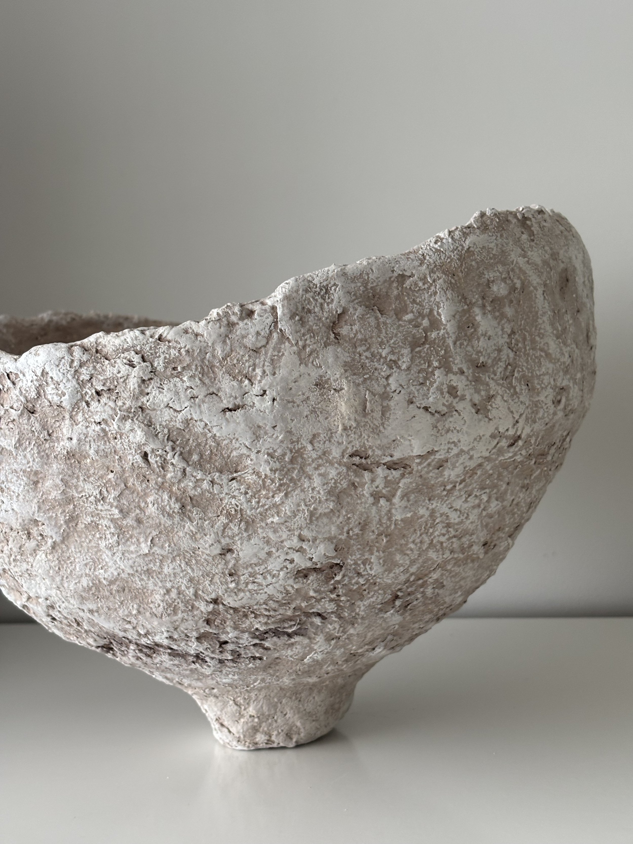 Asymmetric Wabi Sabi Bowl N.9, off-white paper clay bowl viewed from an alternate angle highlighting asymmetrical shape, from Papier Atelier London