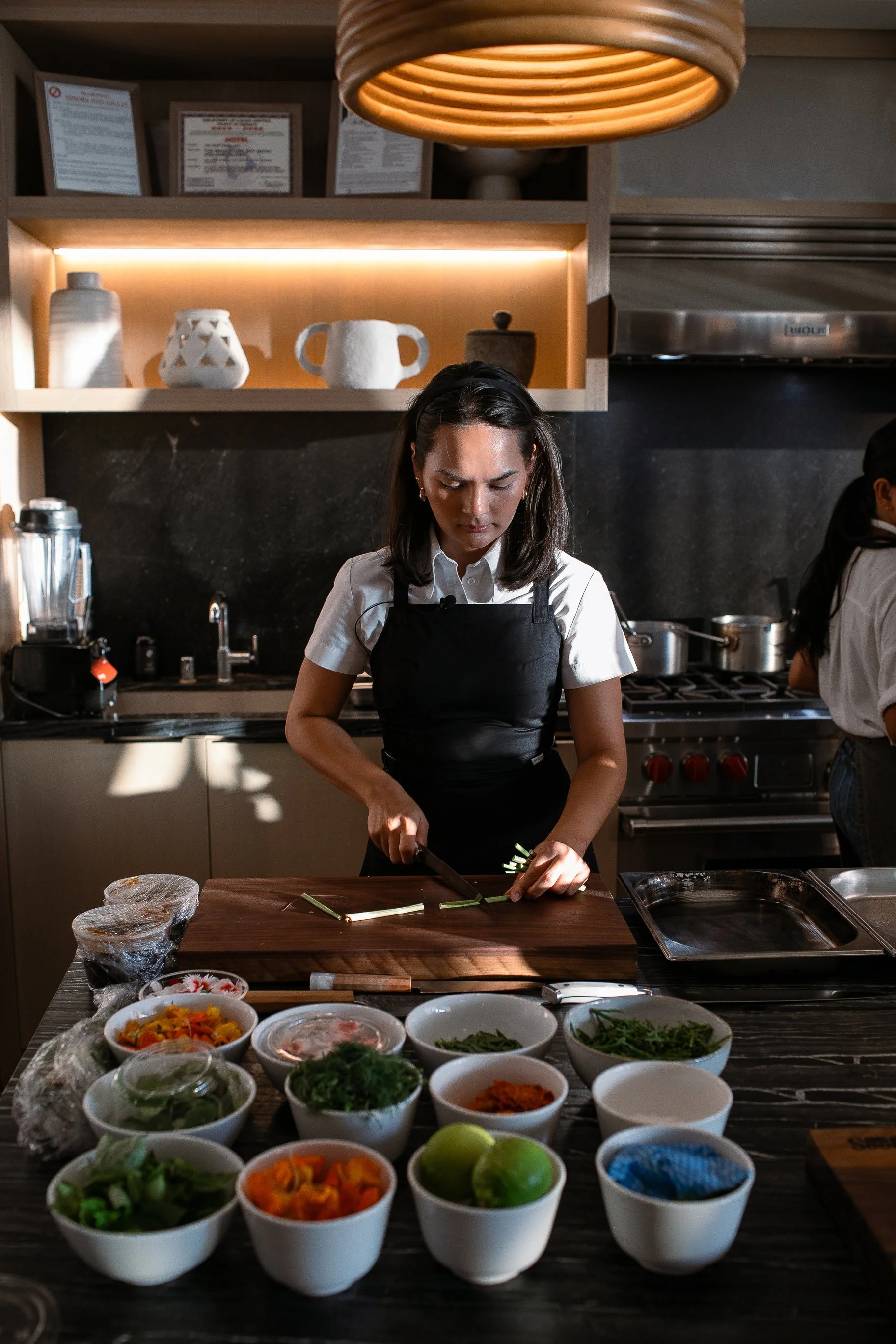 Chef Duyen Ha is cooking in Hawaii at the Francis Brown Club at Mauna Lani with her mise en place in front of her.