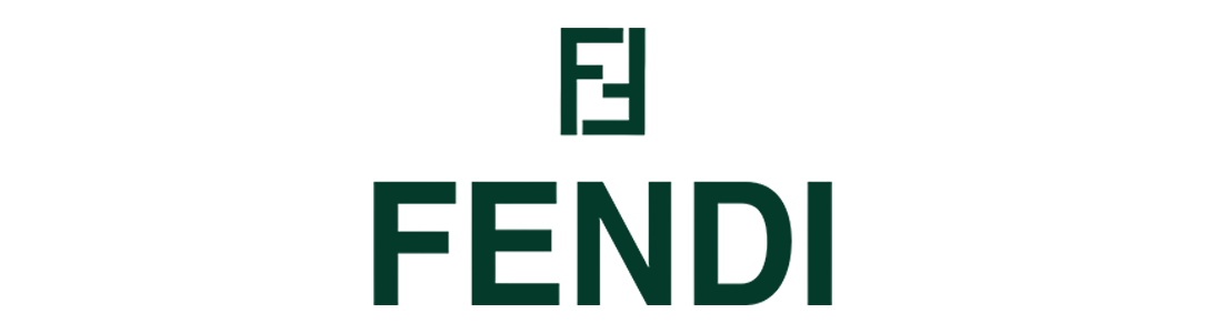 Close-up of the Fendi logo in green letters on a reflective surface with black background.