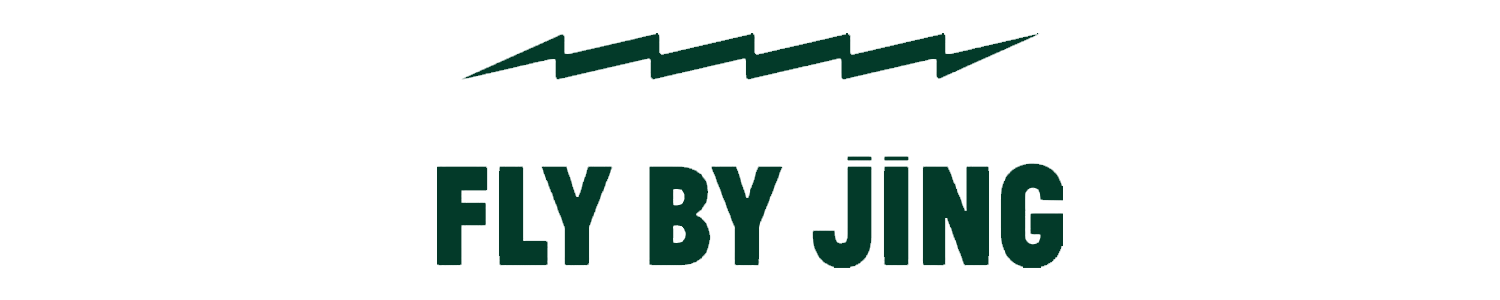Logo of Fly By Jing featuring a stylized city skyline and the text "Fly By Jing."