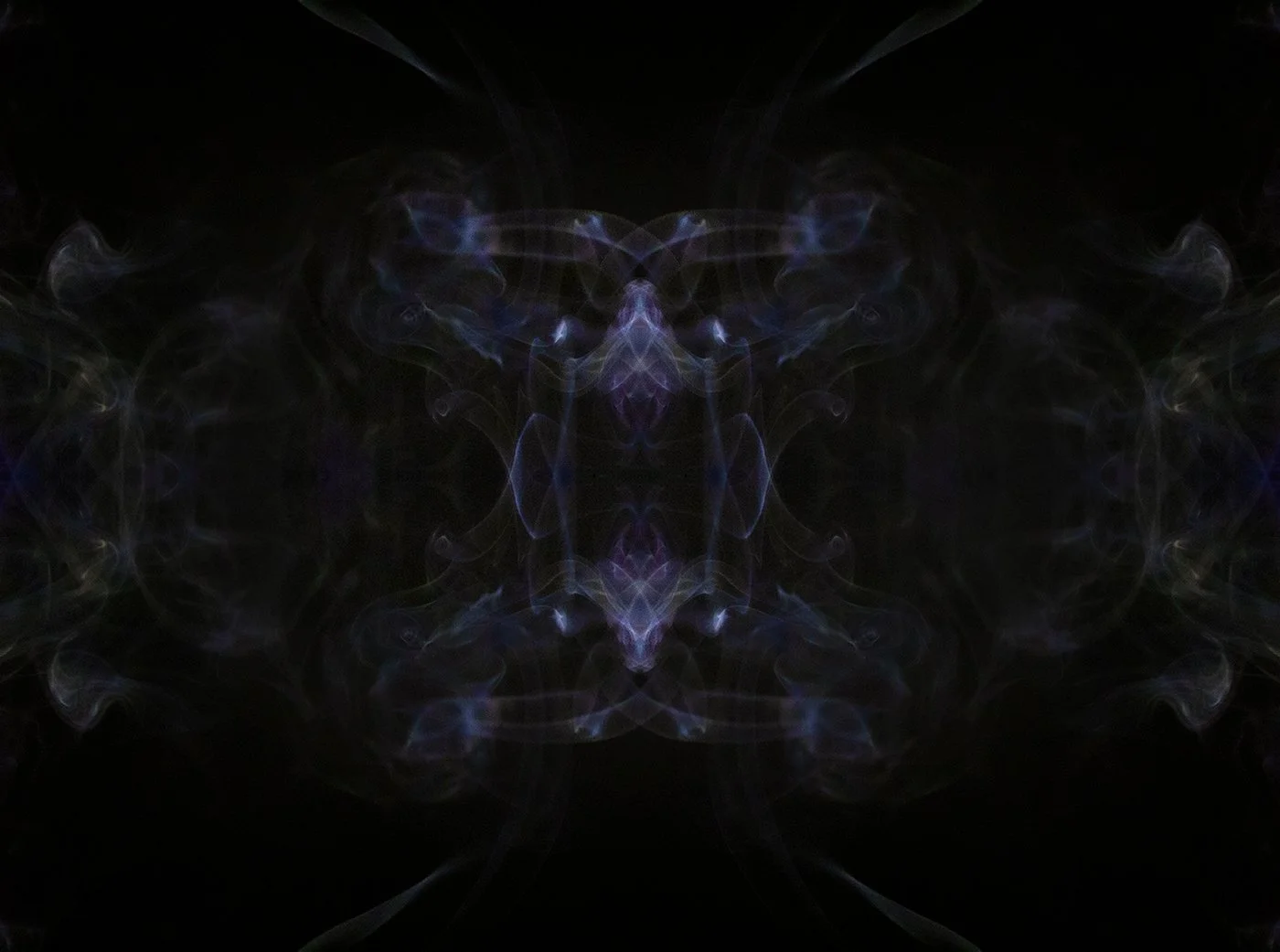 Symmetrical abstract smoke patterns with blue, purple, and green hues against a black background.